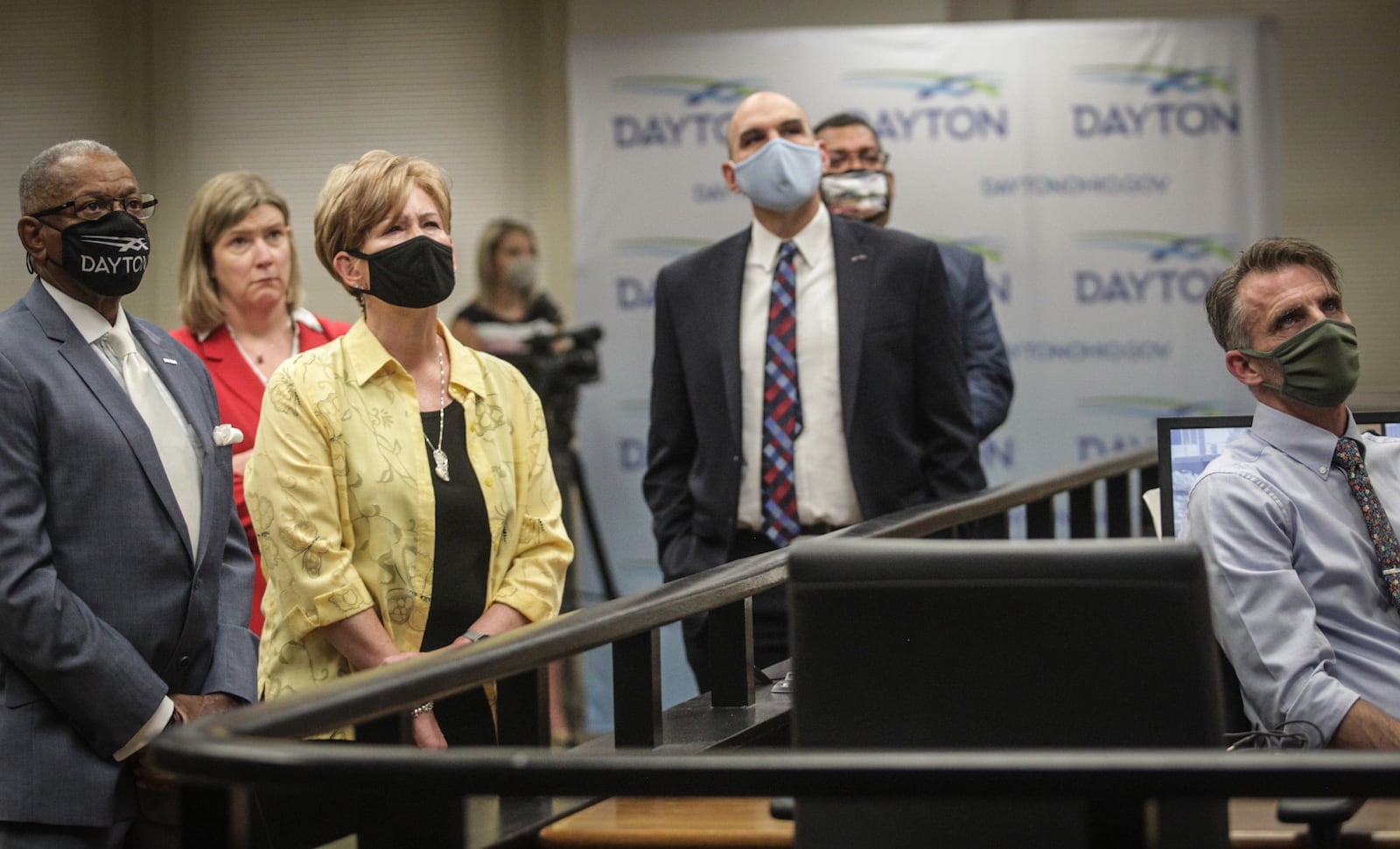 City of Dayton officials review a new internet portal that improve transparency and accountability in police reform. JIM NOELKER/STAFF