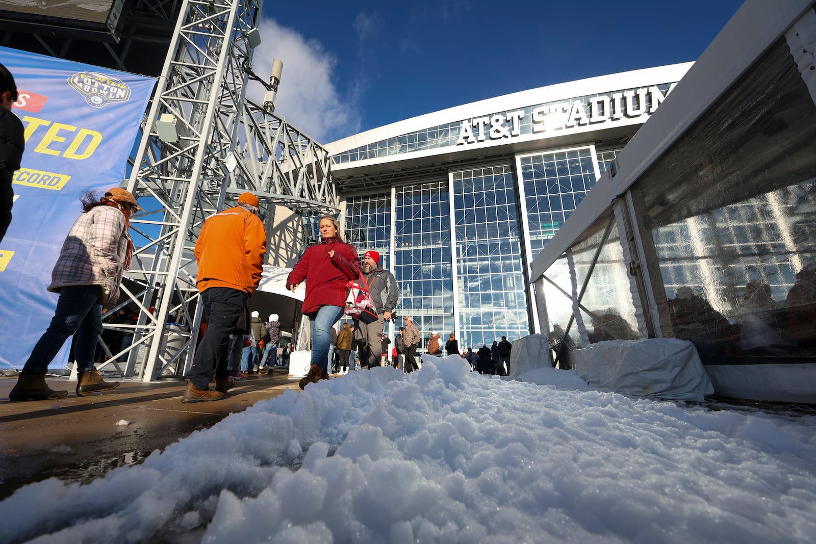 Snow is seen on the ground outside AT&T Stadium prior to the Cotton Bowl College Football Playoff semifinal game between Ohio State and Texas, Friday, Jan. 10, 2025, in Arlington, Texas. (AP Photo/Gareth Patterson)