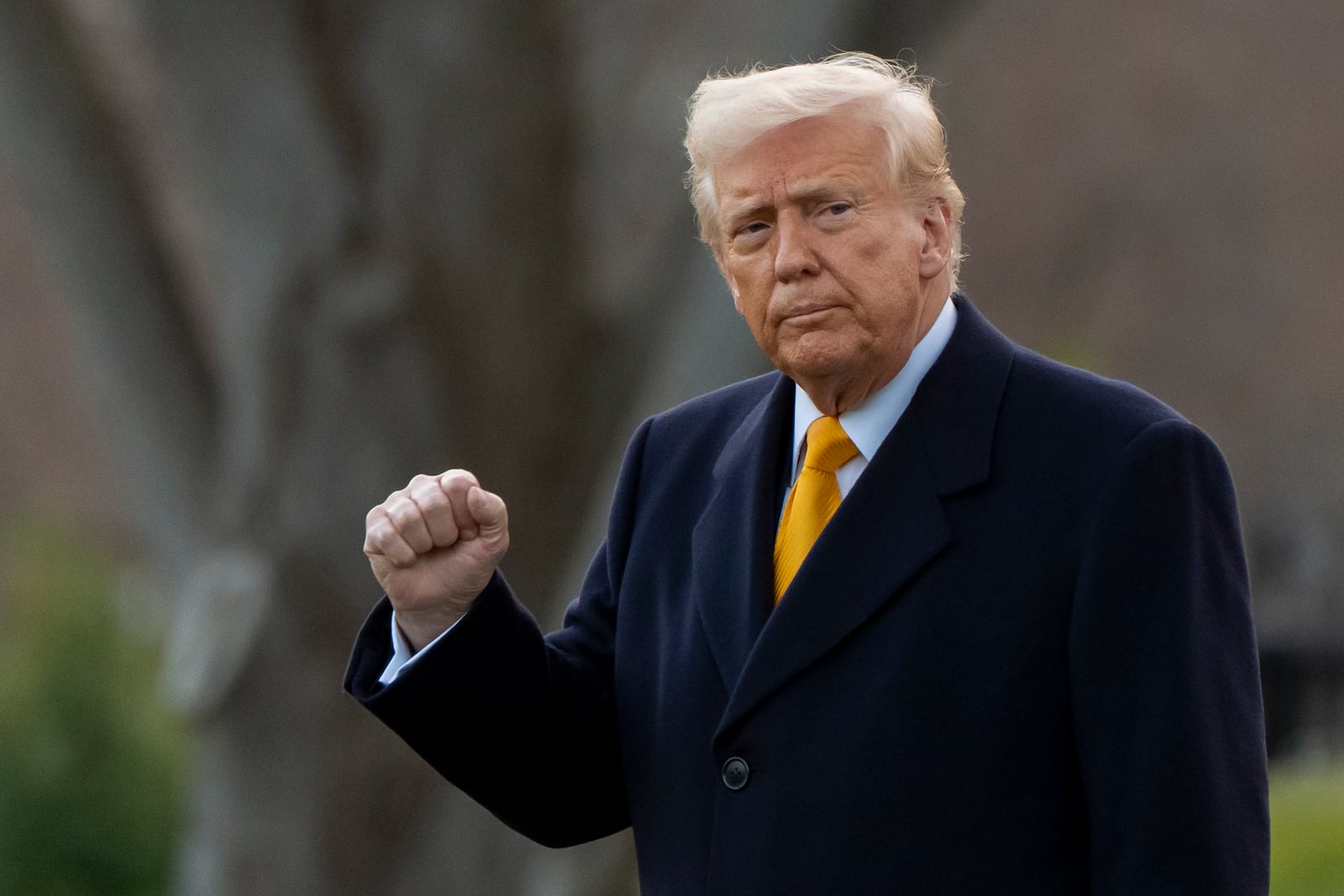 President Donald Trump pumps his fist before departing on Marine One from the South Lawn of the White House, Friday, March 7, 2025, in Washington. (AP Photo/Alex Brandon)