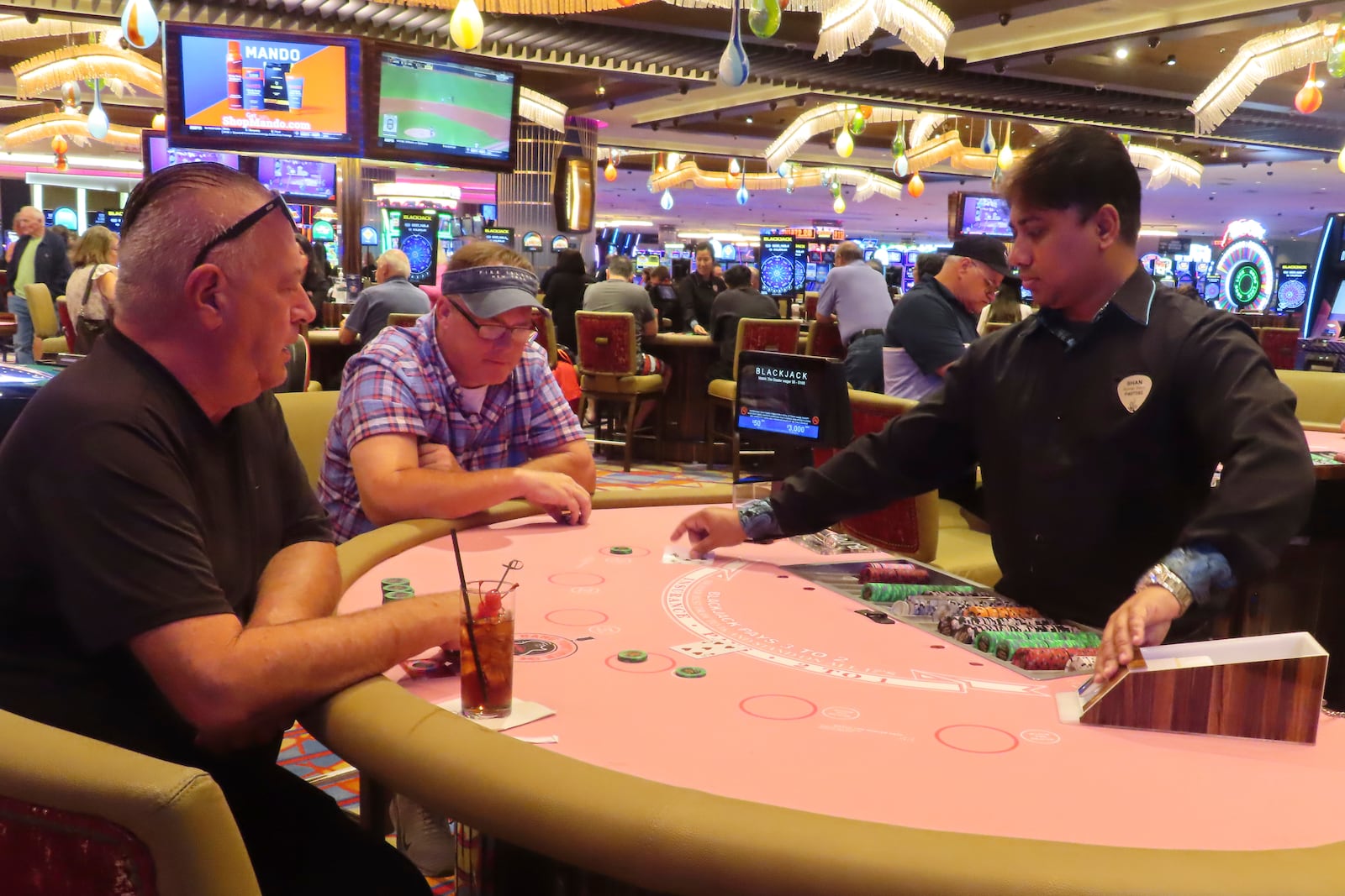 A dealer conducts a card game at the Hard Rock casino in Atlantic City, N.J., on Oct. 3, 2024, a month in which internet gambling set a new revenue record in New Jersey at $213 million. (AP Photo/Wayne Parry)