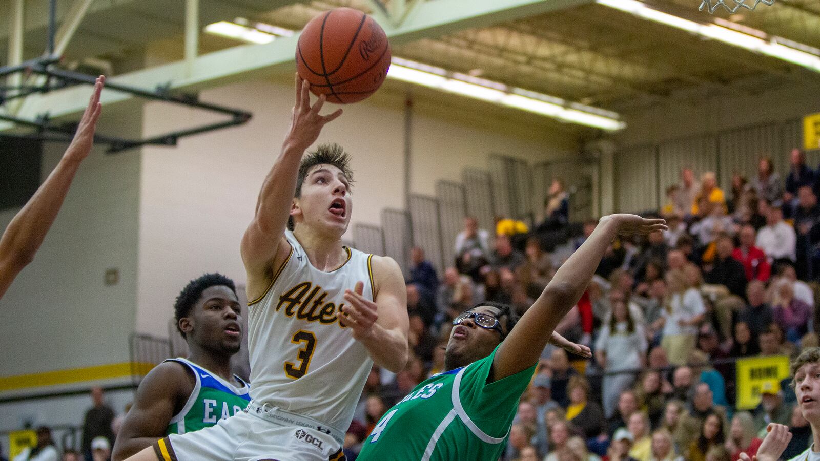 Alter's Anthony Ruffolo shoots over Chaminade Julienne's Bryce Johnson during CJ's 77-70 victory Friday night at Centerville High School. Ruffolo scored 31 points. CONTRIBUTED/Jeff Gilbert