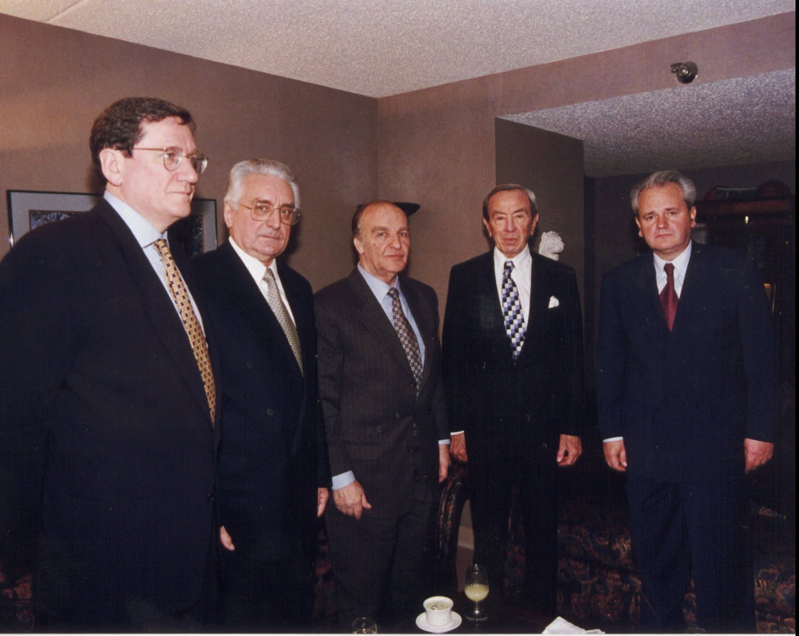 In this photo released by the US State Department, negotiators at the Bosnian peace talks pose for a group photo in Dayton, Ohio, in this 1995 file photo. Pictured left to right, Richard C. Holbrooke, assistant secretary for European and Canadian Affairs; Franjo Tudjman, president of the Republic of Croatia; Alija Izetbegovic, president of the Republic of Bosnia-Herzegovina; Warren Christopher, U.S. secretary of State; Slobodan Milosevic, president of Serbia. The U.S.-brokered accord, reached in Dayton, Ohio, on Nov. 21, 1995, ended Bosnia's 1992-95 war between rival Muslim Bosniaks, Orthodox Serbs and Roman Catholic Croats, who clashed on the republic's future after the former Yugoslav federation fell apart. (AP Photo/U.S. State Department)