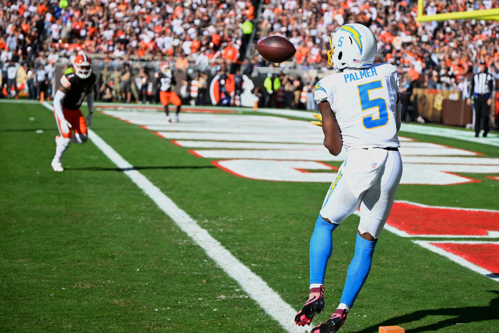 Los Angeles Chargers wide receiver Joshua Palmer (5) catches a touchdown pass against the Cleveland Browns in the first half of an NFL football game Sunday, Nov. 3, 2024, in Cleveland. (AP Photo/David Richard)