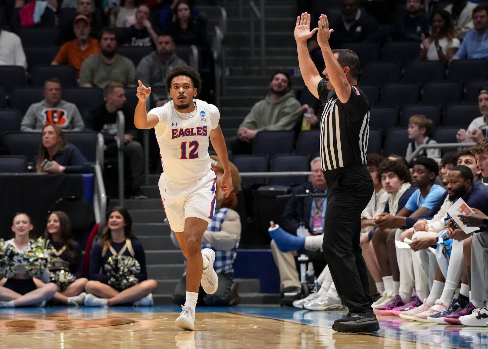 American University guard Geoff Sprouse (12) reacts after scoring during the first half of a First Four college basketball game against Mount St. Mary's in the NCAA Tournament, Tuesday, March 19, 2025, in Dayton, Ohio. (AP Photo/Jeff Dean)