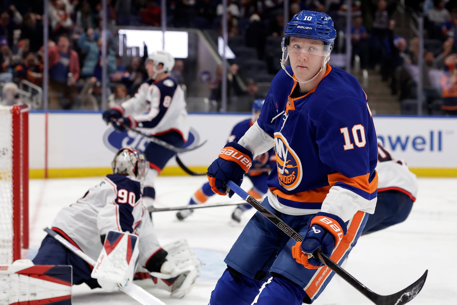 New York Islanders right wing Simon Holmstrom (10) reacts after scoring against Columbus Blue Jackets goaltender Elvis Merzlikins (90) in the second period of an NHL hockey game Monday, Jan. 20, 2025, in Elmont, N.Y. (AP Photo/Adam Hunger)