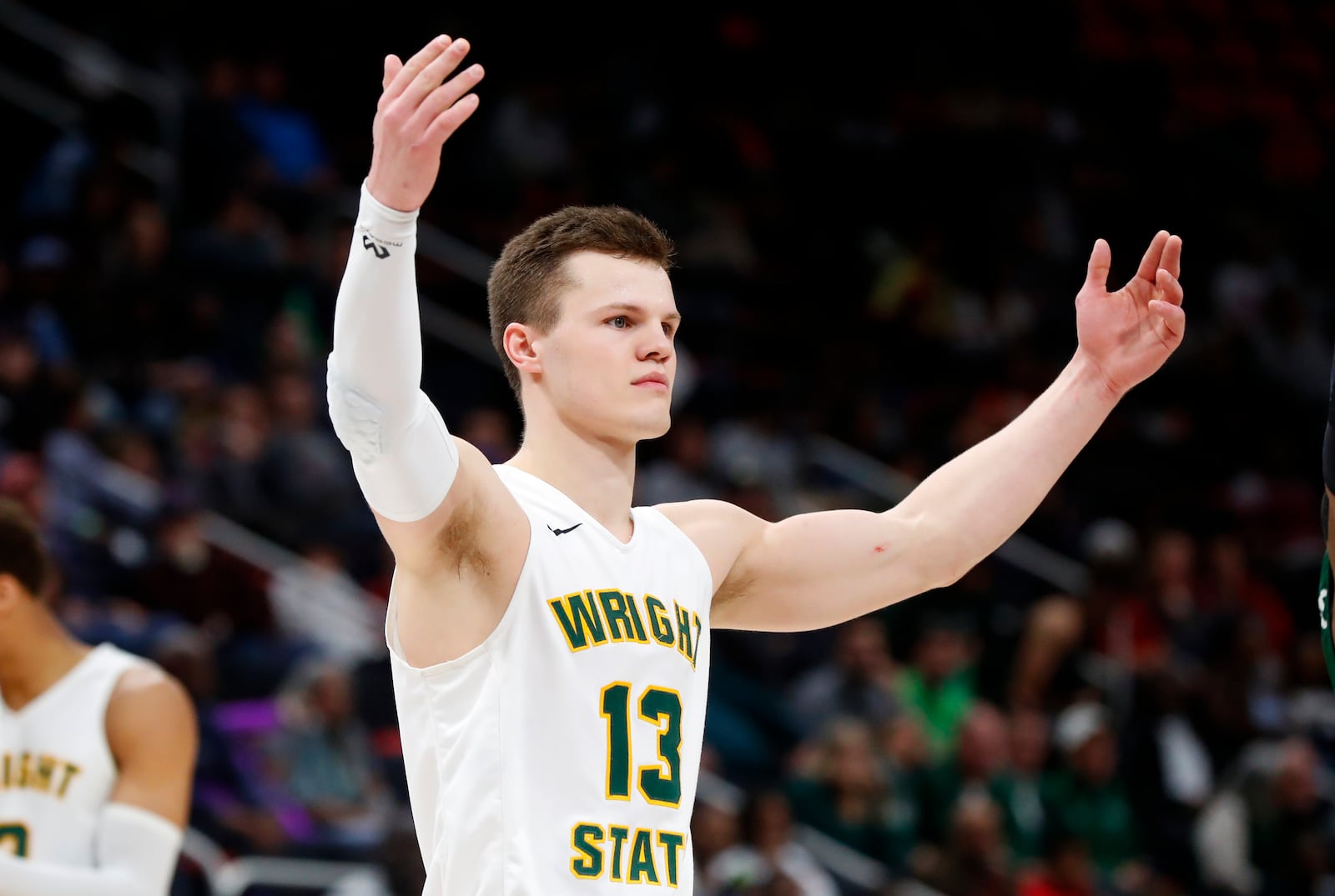 Wright State’s guard Grant Benzinger celebrate’s during their 74-57 win against Cleveland State during the second half of an NCAA basketball game in the Horizon League tournament championship in Detroit, Tuesday, March 6, 2018. (AP Photo/Paul Sancya)