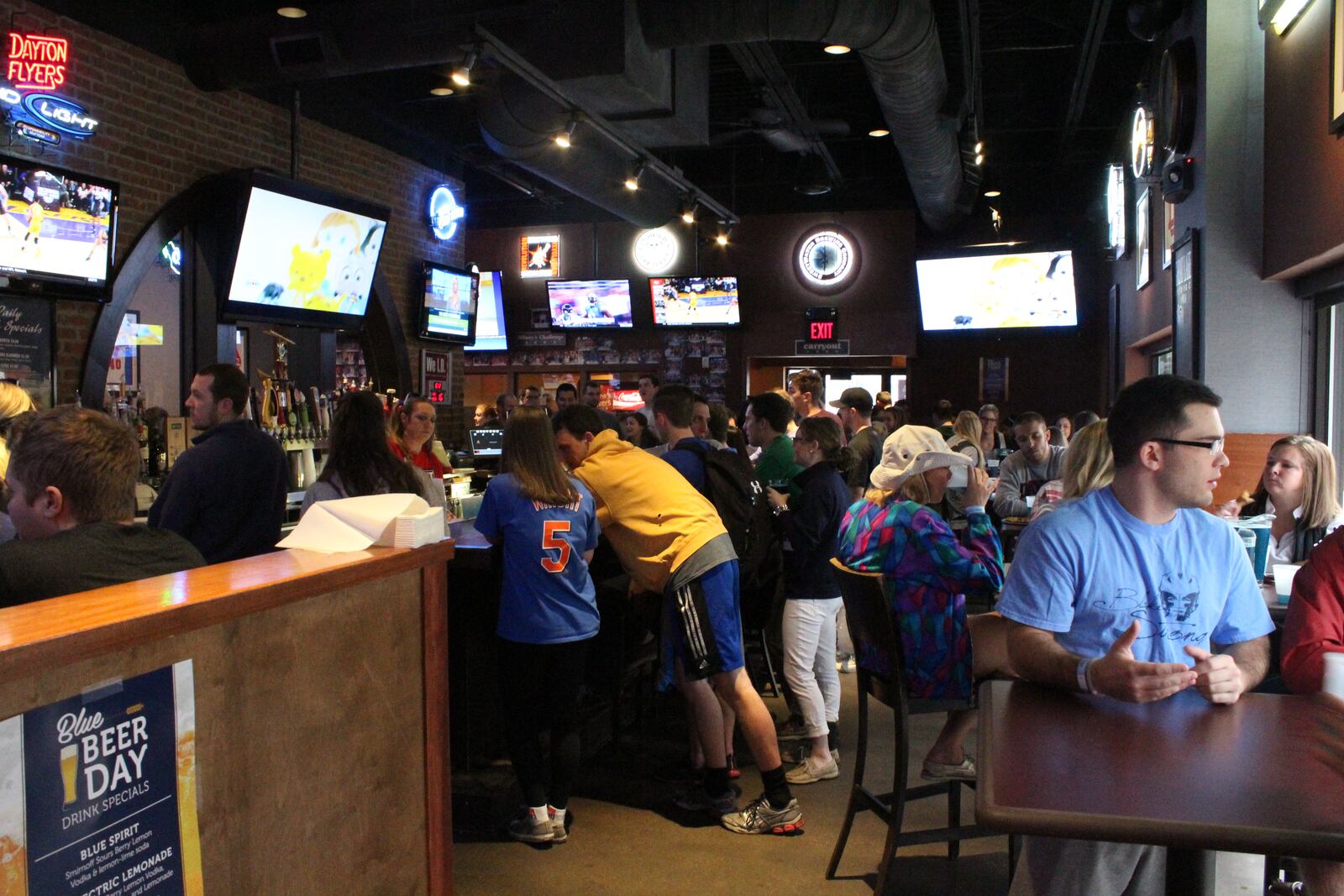 For the ninth year running, University of Dayton students and other area revelers rose early the Wednesday before St. Patrick's Day to celebrate Blue Beer Day at Milano's Pizza, Subs and Taps, 1820 Brown St., drinking blue-dyed Budweiser, playing water pong, and enjoying the great weather. VIVIENNE MACHI / STAFF