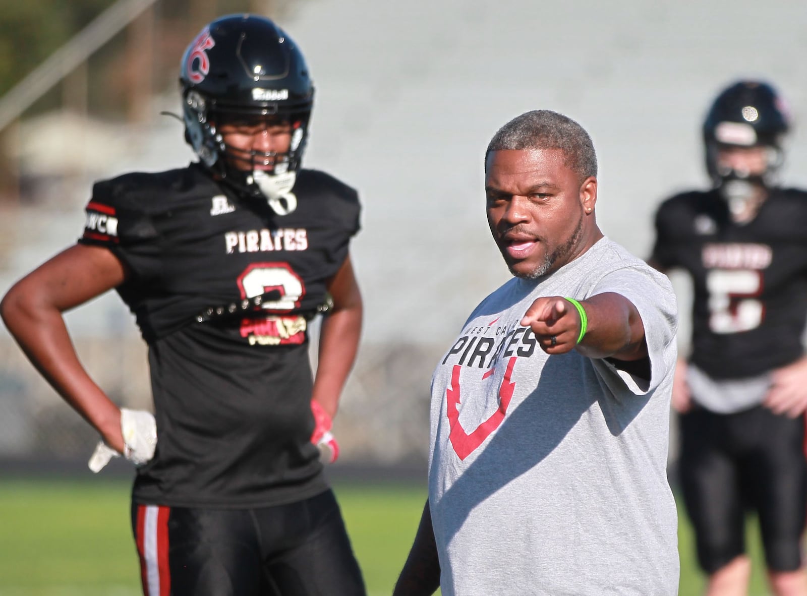 West Carrollton High School football head coach Dion Black instructs the Pirates during practice on Wednesday, Oct. 9, 2019. Black will coach the South squad in Friday's MVFCA All-Star Game. FILE PHOTO