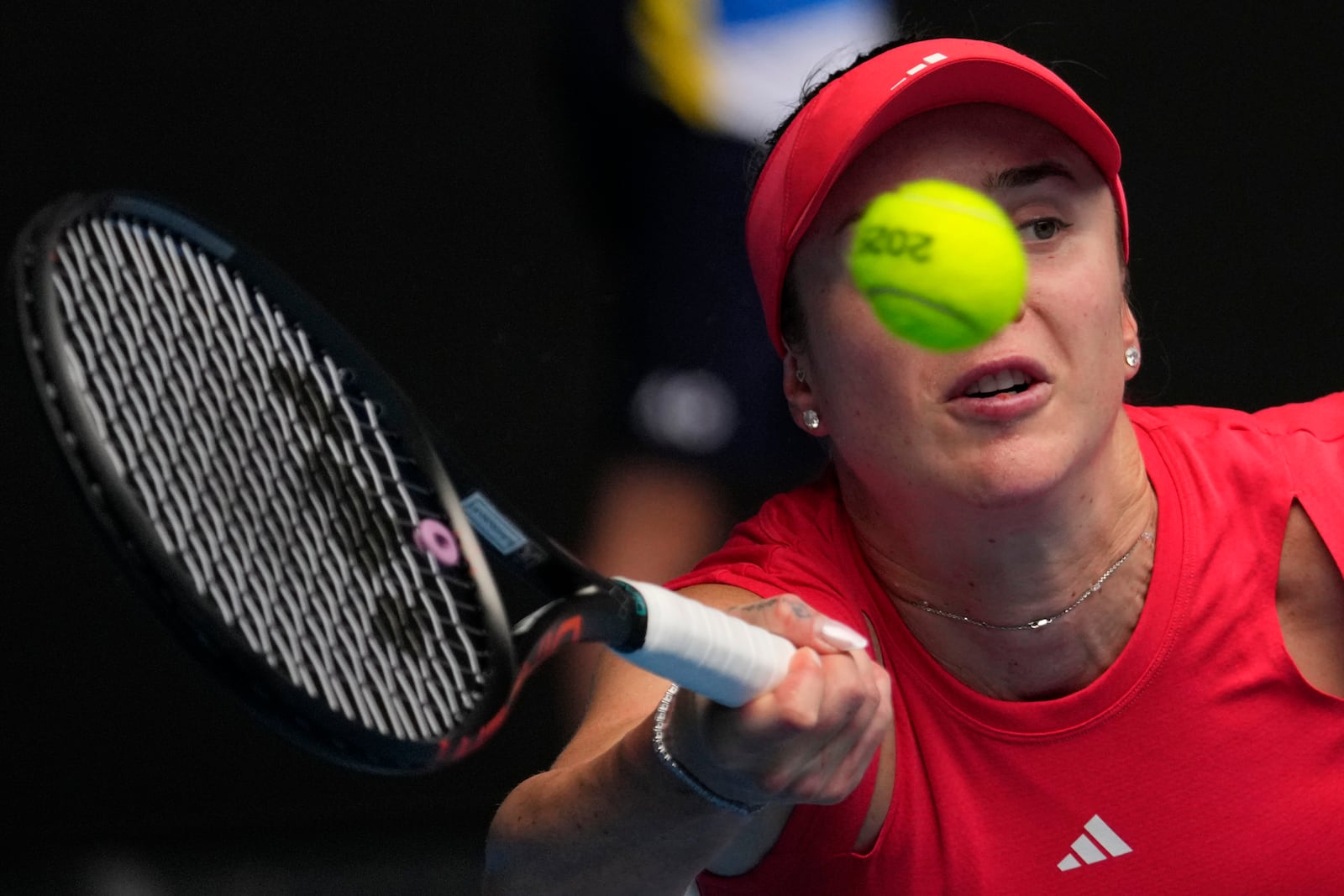 Elina Svitolina of Ukraine plays a forehand return to Veronika Kudermetova of Russia during their fourth round match at the Australian Open tennis championship in Melbourne, Australia, Monday, Jan. 20, 2025. (AP Photo/Vincent Thian)