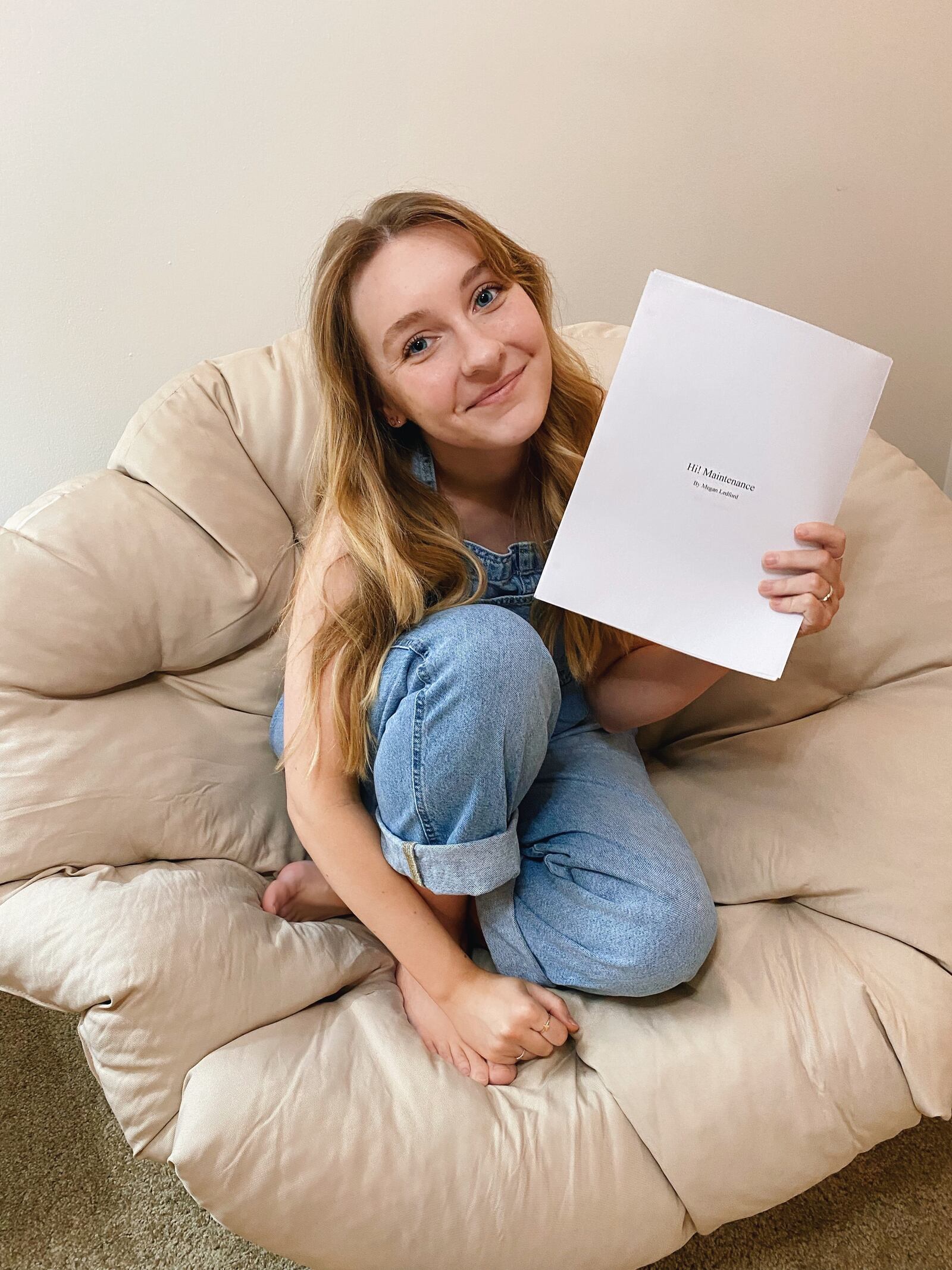 Wright State senior Megan Ledford with her play, "Hi! Maintenance," which earned her a win in the Jackie Demaline Regional Collegiate Playwriting Competition.