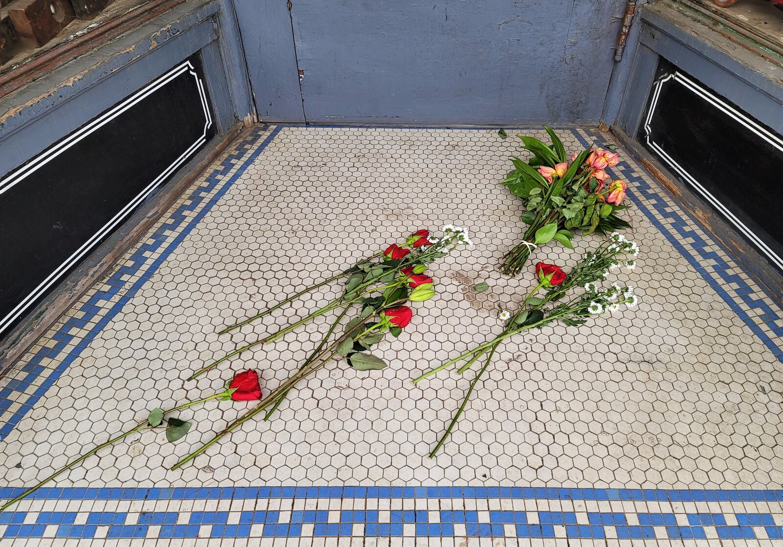 Friends left flowers at the front door of Seldon D. Brown's woodworking shop after he died Friday. NICK GRAHAM/STAFF