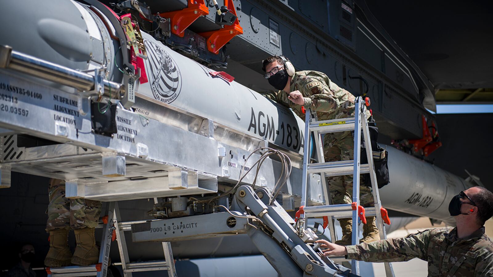 Staff Sgt. Jacob Puente, 912th Aircraft Maintenance Squadron, helps line up the AGM-183A Air-launched Rapid Response Weapon Instrumented Measurement Vehicle 2 as it is loaded under the wing of a B-52H Stratofortress at Edwards Air Force Base, Calif., Aug. 6. The ARRW IMV-2 successfully completed a captive carry test off the Southern California coast Aug. 8. (U.S. Air Force photo/Giancarlo Casem)