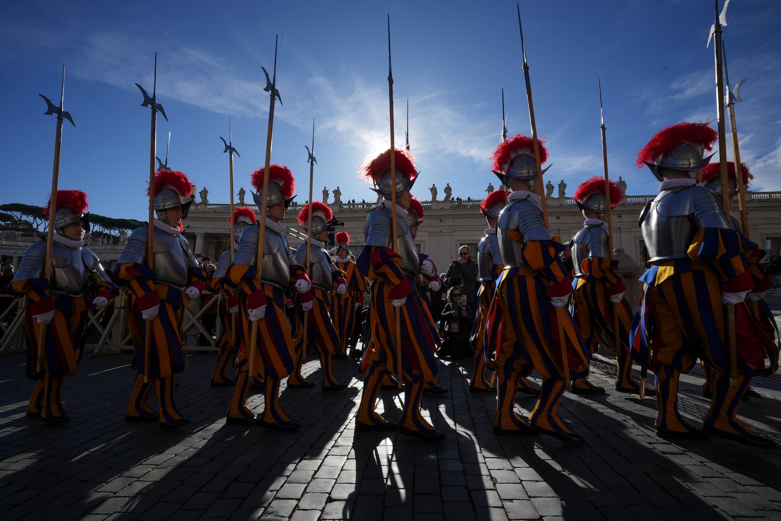 Swiss Guards march in front of St. Peter's Basilica at the Vatican, Wednesday, Dec. 25, 2024. (AP Photo/Andrew Medichini)