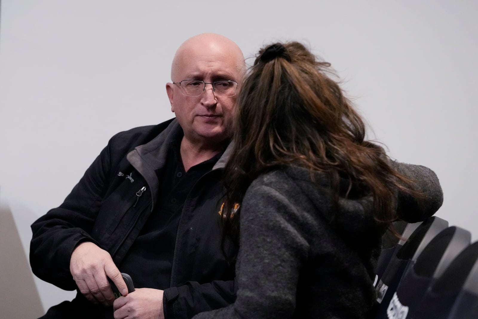 Robert E. Crimo III's parents, father, Robert Crimo Jr., left, talks with his mother Denise Pesina before Judge Victoria A. Rossetti during the jury selection for the trial of Robert E. Crimo III., at the Lake County Courthouse, Waukegan, Ill., Monday, Feb. 24, 2025. (AP Photo/Nam Y. Huh, Pool)