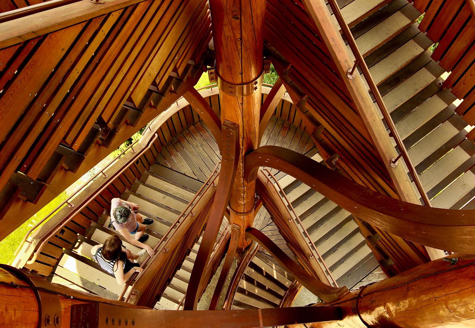 Kayla Hiles, left and Lorelei Fink descend the stairs of the Cox Arboretum Tree Tower on Thursday after taking in the sights from the top observation level. The tower rises 46 feet in the conifer collection area of the park. JIM WITMER/STAFF