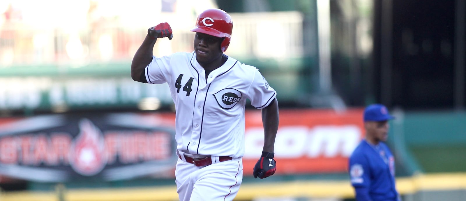 The Reds’ Aristides Aquino rounds the bases after a two-run home run in the second inning against the Cubs on Friday, Aug. 9, 2019, at Great American Ball Park in Cincinnati. David Jablonski/Staff