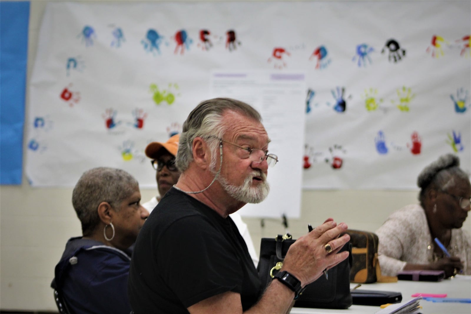 A resident asks questions at a community meeting where visitors provided feedback about Dayton's proposed housing policies. CORNELIUS FROLIK / STAFF