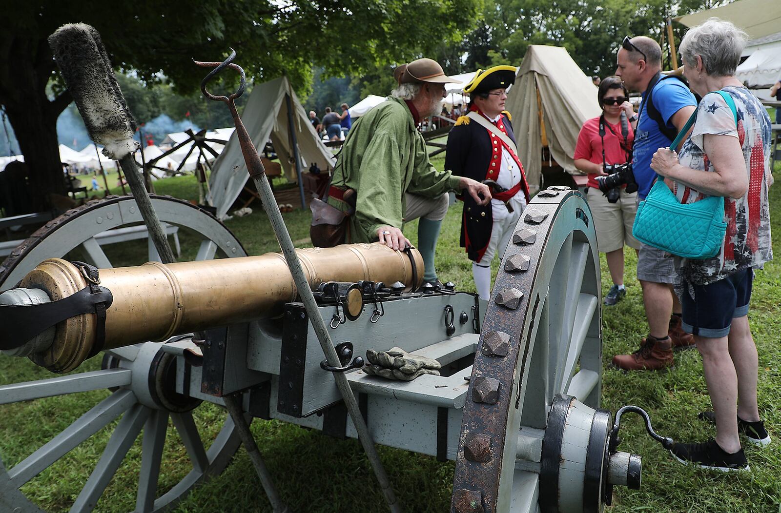 Larry Pfeifer, left, and Dale Hawley talk to visitors about life in the 1st. Mad River Lite Artillary Unit at last year’s Fair at New Boston Saturday. BILL LACKEY/STAFF