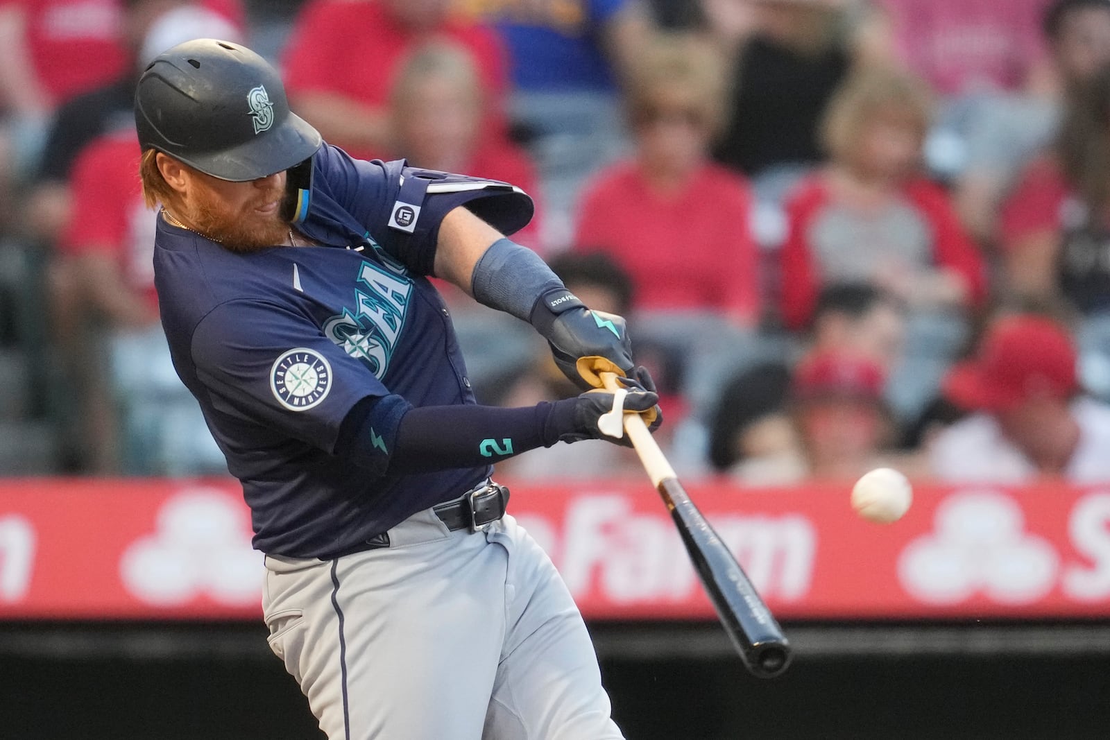 FILE - Seattle Mariners' Justin Turner hits a home run during the second inning of a baseball game against the Los Angeles Angels in Anaheim, Calif., Saturday, Aug. 31, 2024. (AP Photo/Ashley Landis, File)