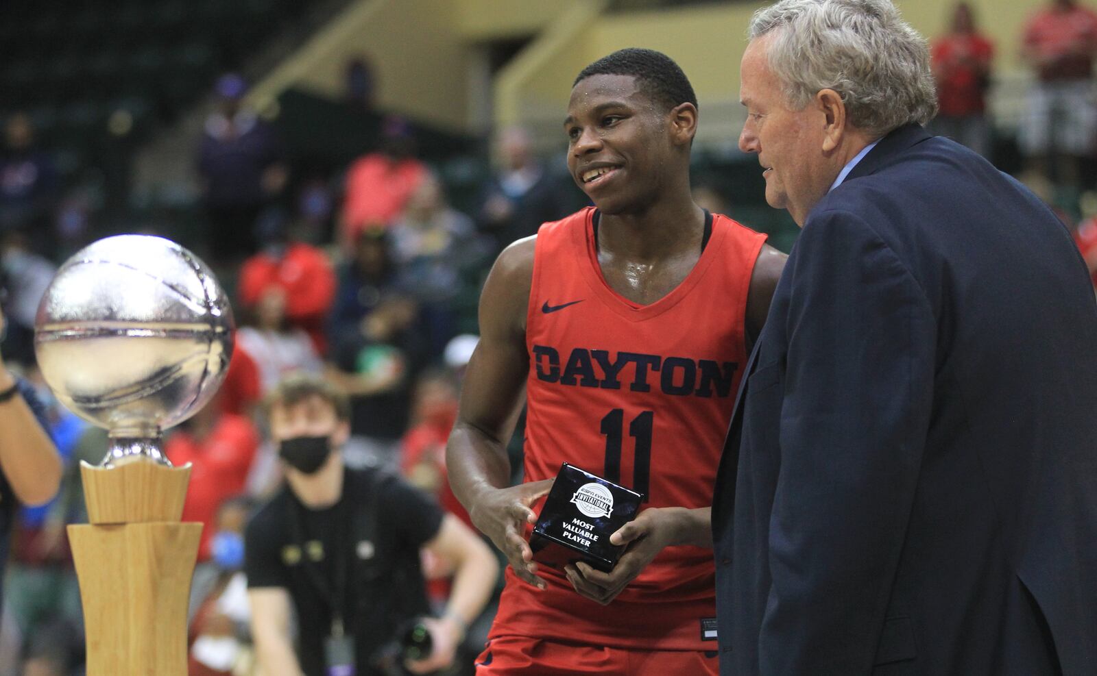 Dayton's Malachi Smith accepts the tournament MVP trophy after a victory against Belmont on Sunday, Nov. 28, 2021, in the championship game of the ESPN Events Invitational at HP Fieldhouse in Kissimmee, Fla. David Jablonski/Staff