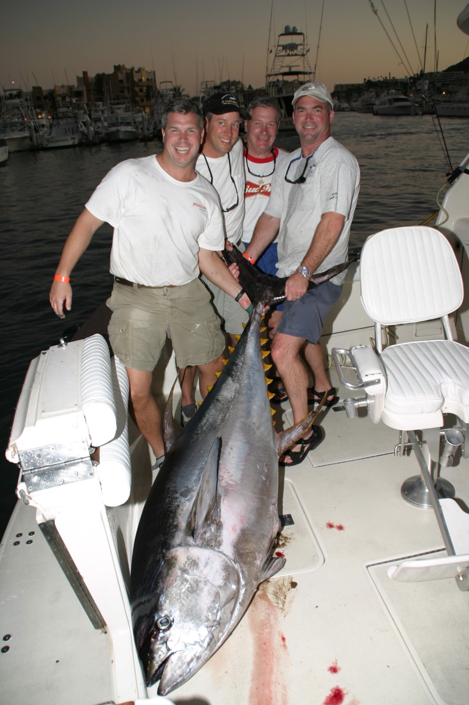 Team Buckeye Tuna – (left to right) Jamie Greer; Dave Dunton; Dave Greer and Lance Gildner – with their 7-foot, 318-pound yellowfin tuna that won the 2006 San Luis Cabo Tuna Jackpot Tournament in Cabo San Lucas, Mexico. Today the mounted fish hangs on the Monument Avenue office of Dayton attorney Jamie Greer of  the Bieser, Greer & Landis law firm. CONTRIBUTED