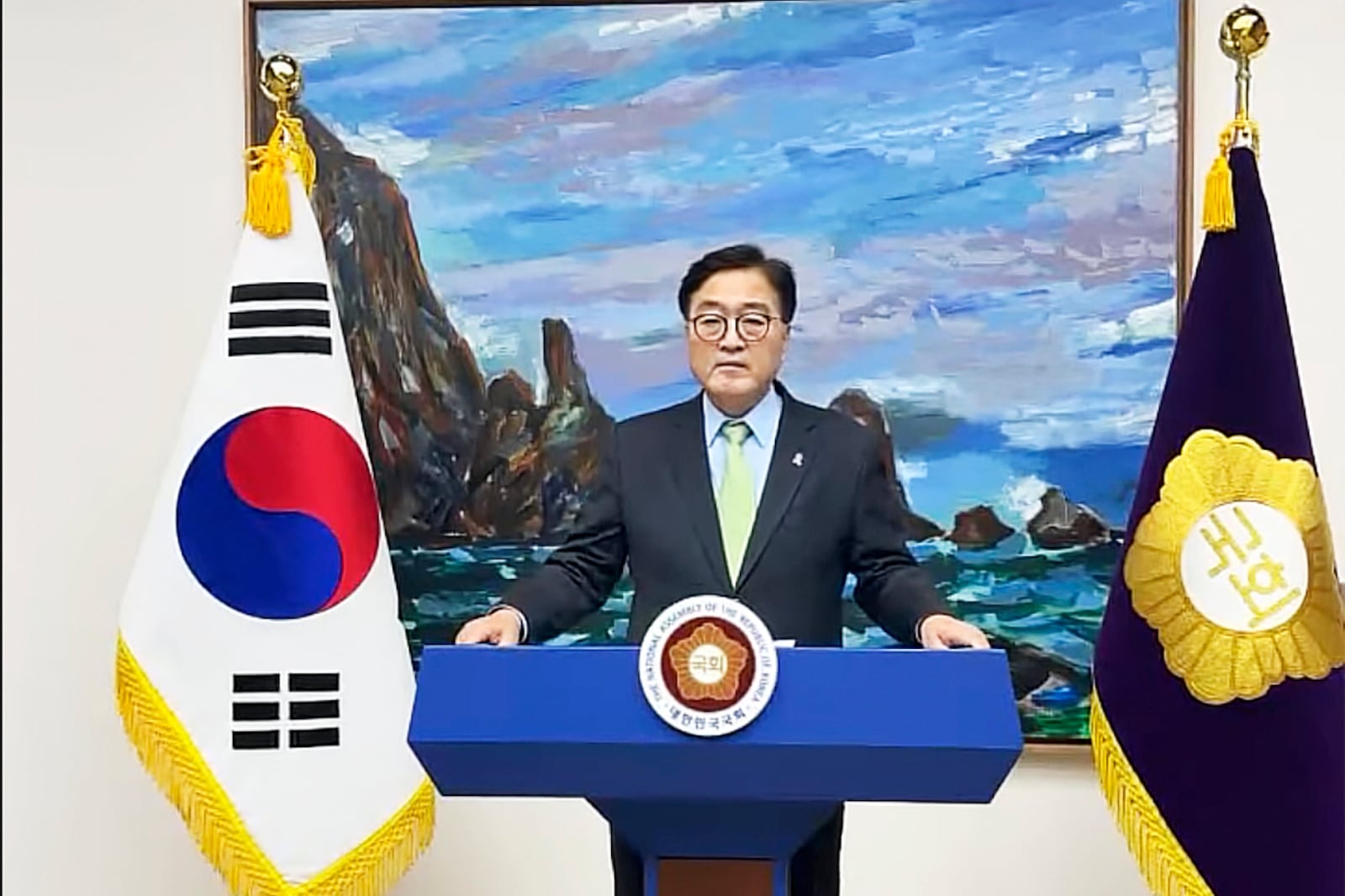 In this photo taken from video released by South Korea's National Assembly Speaker's Office on Tuesday, Dec. 3, 2024, South Korea's National Assembly Speaker Woo Won-shik delivers his speech. (South Korea's National Assembly Speaker's Office via AP)