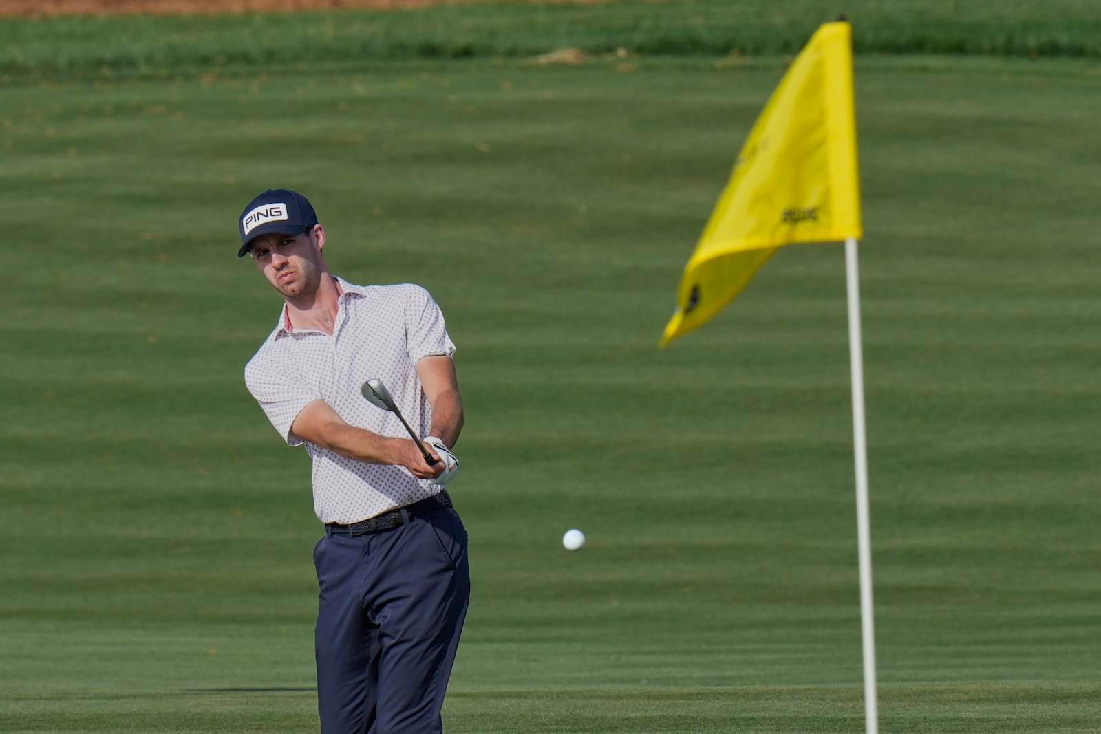 Alex Smalley chips onto the 11th green during the third round of The Players Championship golf tournament Saturday, March 15, 2025, in Ponte Vedra Beach, Fla. (AP Photo/Chris O'Meara)