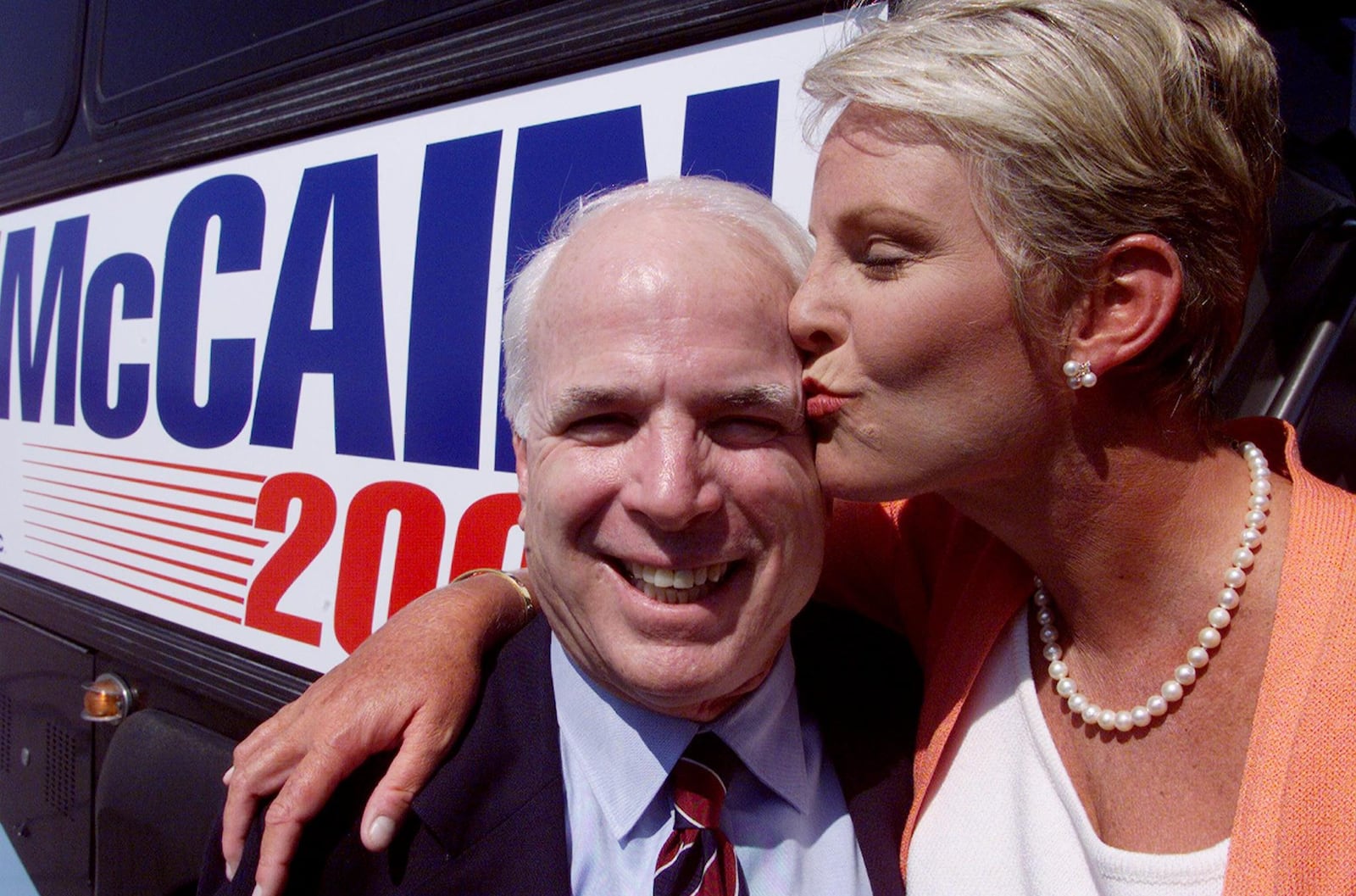 Presidential hopeful Sen. John McCain (R-Ariz.) gets a kiss from his wife, Cindy, in 199 as they kick off his campaign in Greenville, S.C.  