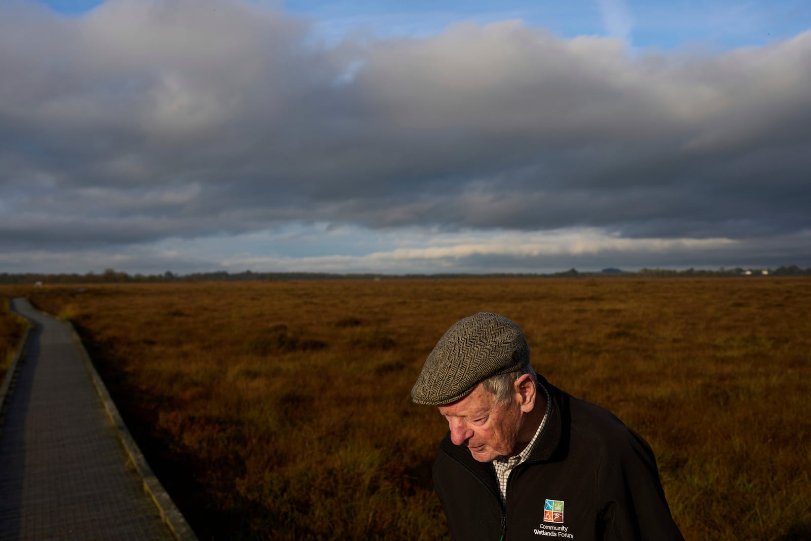 Bog expert Brian Sheridan walks along a boardwalk in the protected Clara Bog Nature Reserve that data center developers consider a potential growth region, in Clara, Ireland, Wednesday, Oct. 16, 2024. (AP Photo/Bram Janssen)