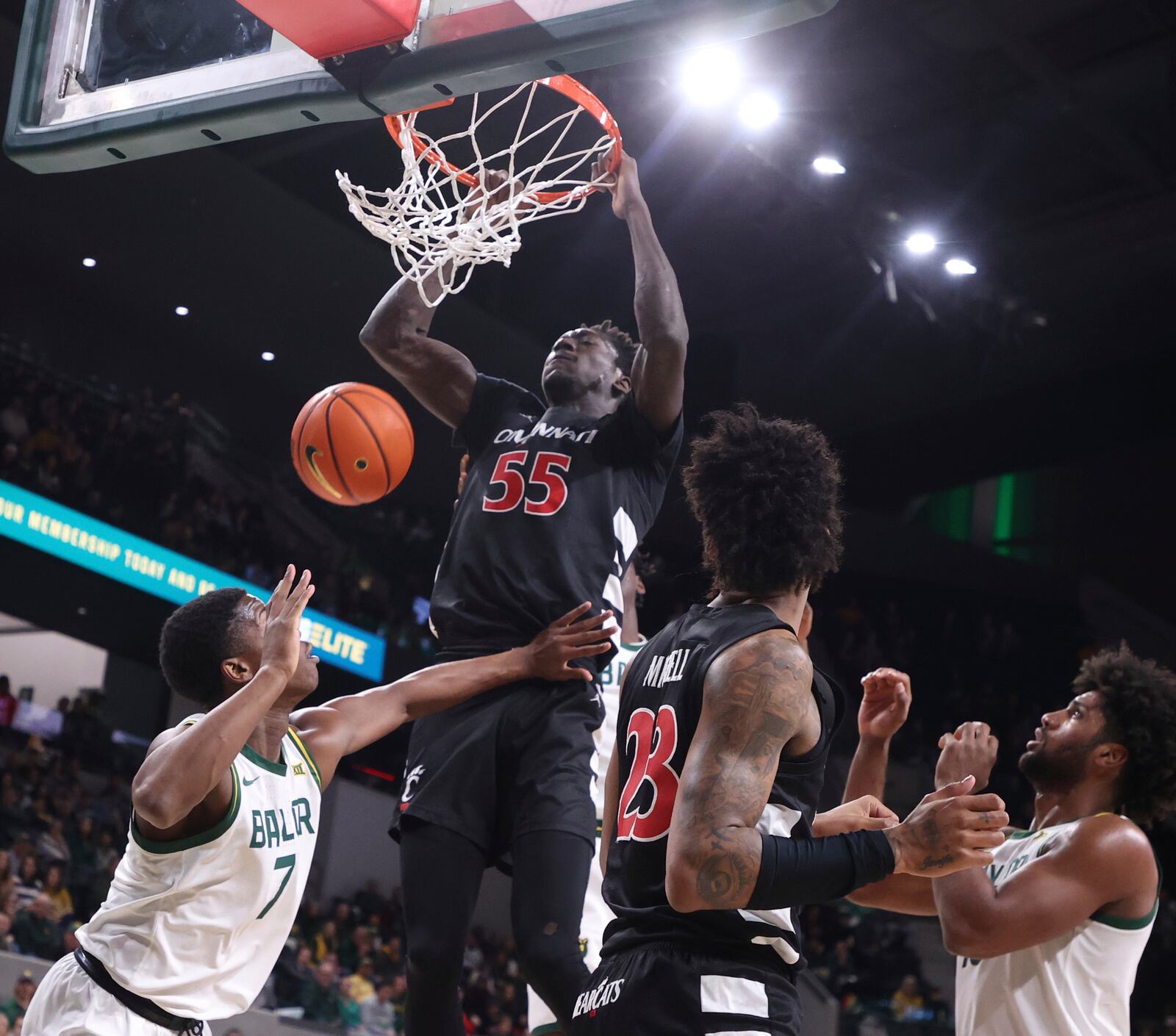 Cincinnati forward Aziz Bandaogo dunks over Baylor guard VJ Edgecombe in the first half of an NCAA college basketball game, Tuesday, Jan. 7, 2025, in Waco, Texas. (Rod Aydelotte/Waco Tribune-Herald via AP)