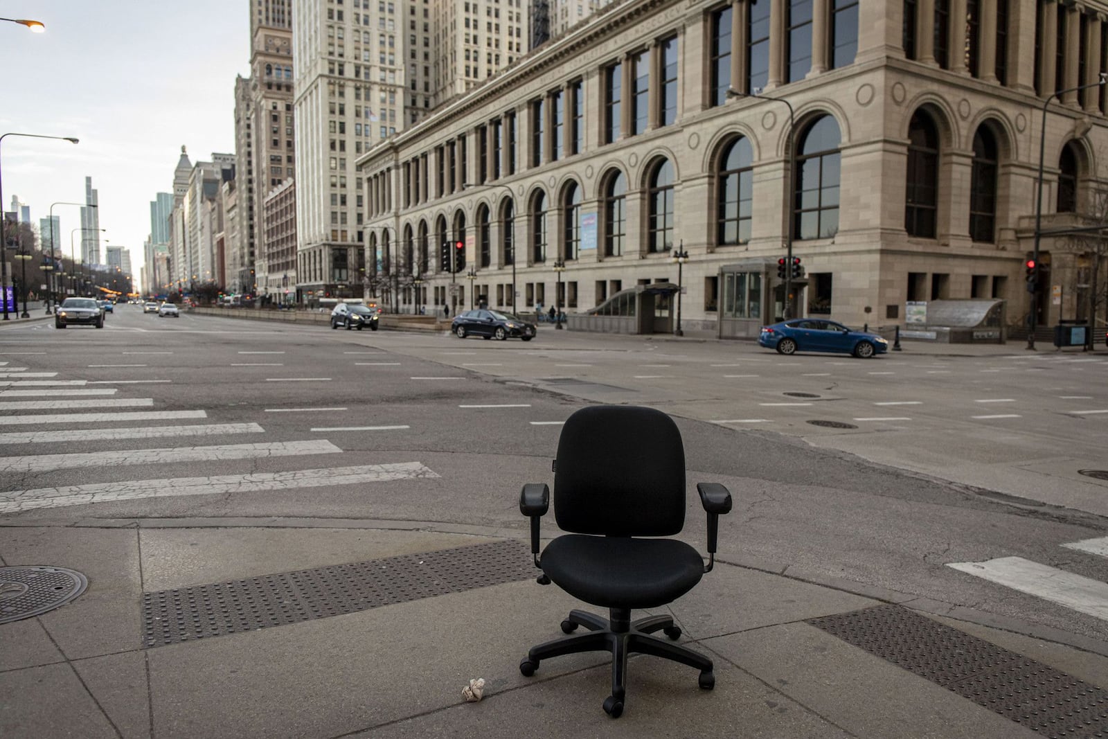 An abandoned desk chair at Michigan Avenue and Randolph Street during the 5 p.m. evening rush hour on March 17, 2020, in Chicago's Loop. (Brian Cassella/Chicago Tribune/TNS)