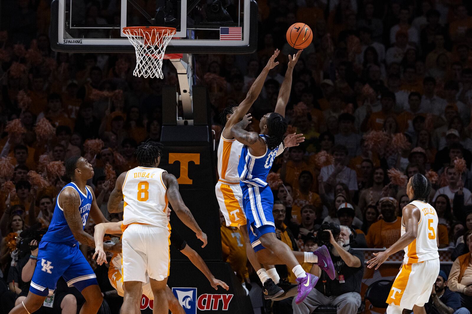 Kentucky guard Otega Oweh (00) shoots as he's fouled by Tennessee guard Jordan Gainey during the first half of an NCAA college basketball game Tuesday, Jan. 28, 2025, in Knoxville, Tenn. (AP Photo/Wade Payne)