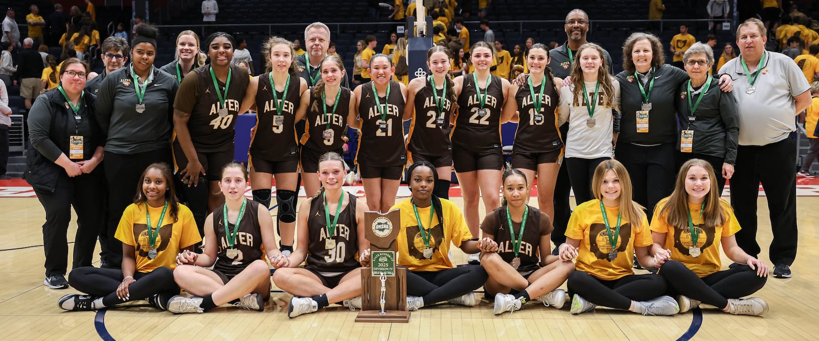 Alter players and coaches pose for a team photo with the Division IV state runner-up trophy on Friday at University of Dayton Arena. BRYANT BILLING / STAFF