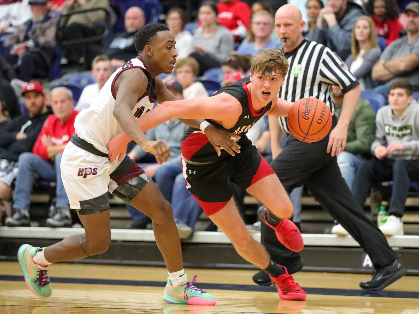 Preble Shawnee's Mason Shrout drives past a Harvest Prep defender during the Division III regional final game Saturday, March 11, 2023 at Trent Arena in Kettering. Preble Shawnee lost to Canal Winchester Harvest Prep 56-49. CONTRIBUTED PHOTO BY MICHAEL COOPER