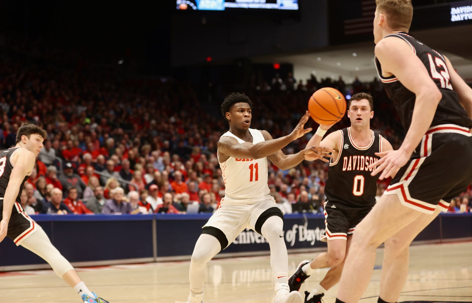 Dayton's Malachi Smith makes a pass against Davidson on Tuesday, Jan. 17, 2023, at UD Arena. David Jablonski/Staff