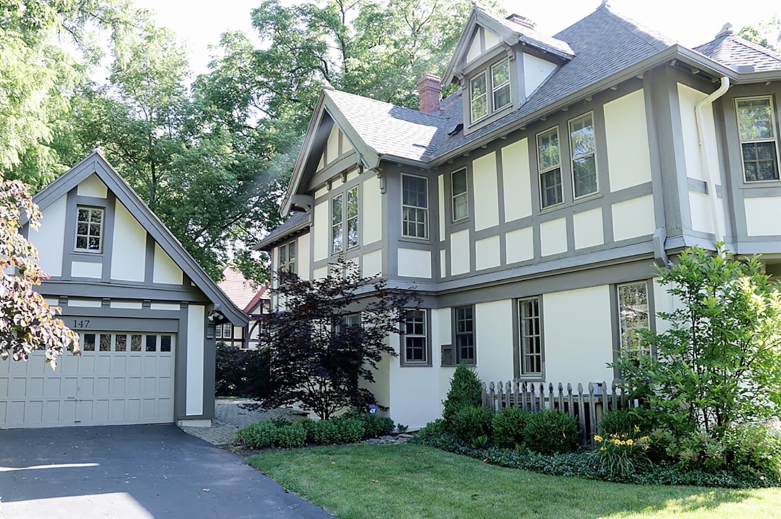 The house sits well off the sidewalk with the formal entry facing the connecting cross road. Access to the 2-car, detached garage is off the boulevard. Paver-bricks create a patio that connects the house to the garage and wraps around the house to the covered side patio and the formal entry. CONTRIBUTED PHOTO BY KATHY TYLER