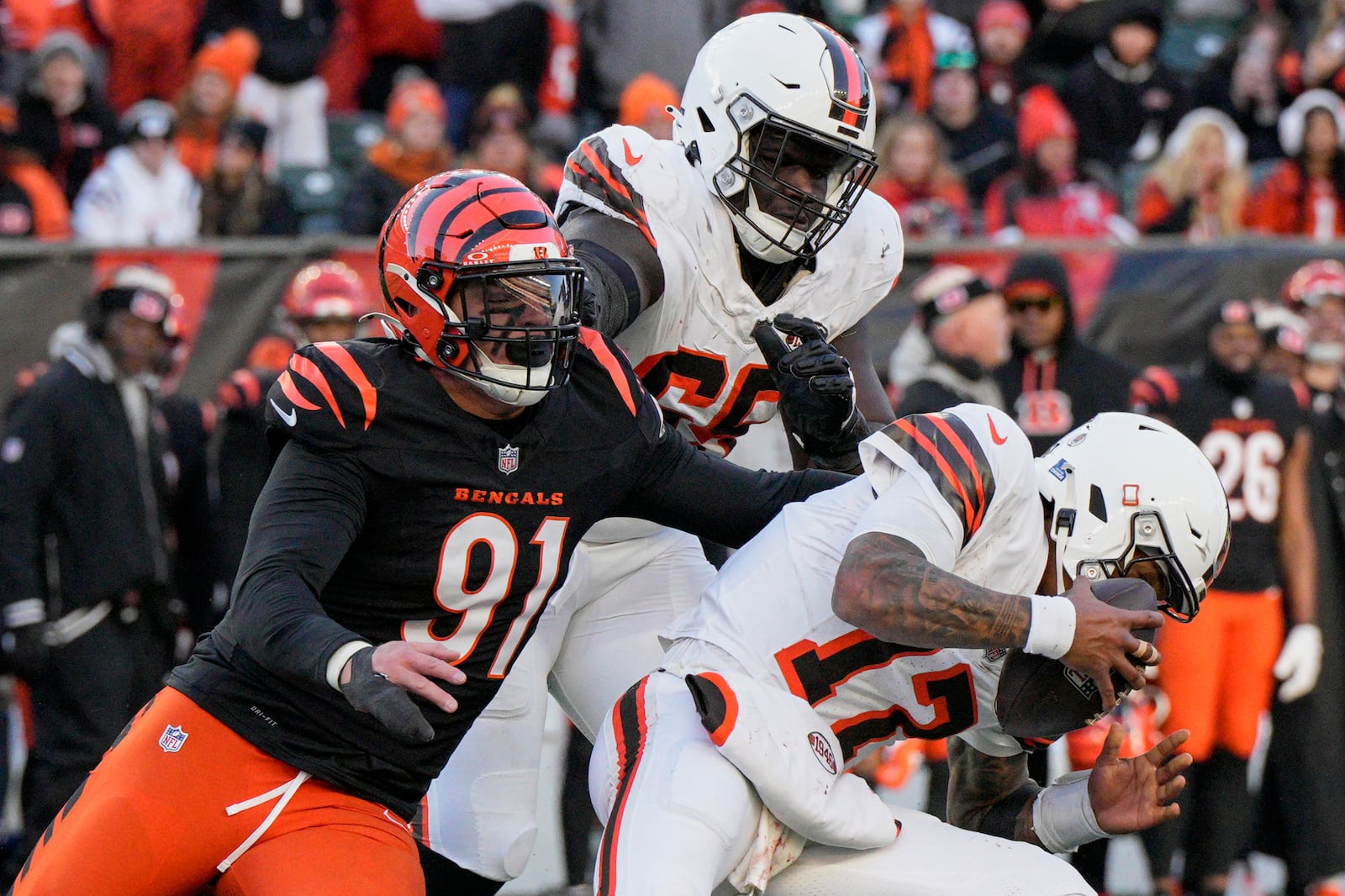 FILE - Cleveland Browns quarterback Dorian Thompson-Robinson (17) is pressured by Cincinnati Bengals defensive end Trey Hendrickson (91) during an NFL football game Sunday, Dec. 22, 2024, in Cincinnati. (AP Photo/Jeff Dean, FIle)