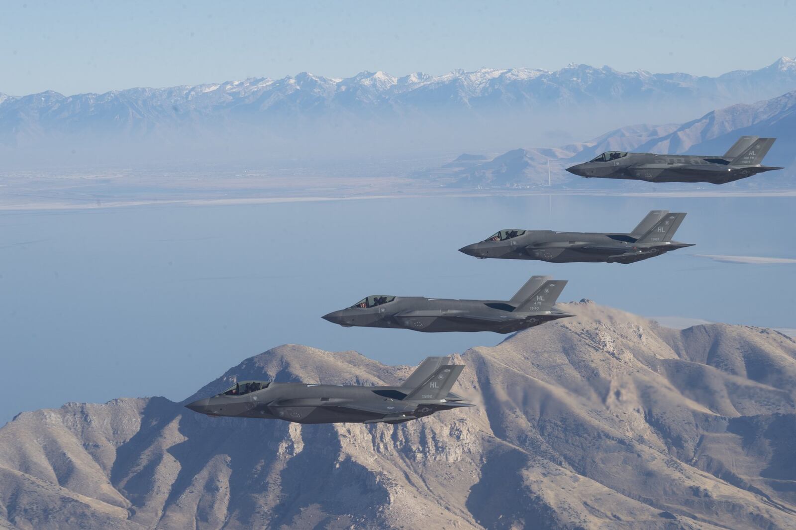 A formation of F-35 Lightning IIs from the 388th Fighter Wing and 419th FW stationed at Hill Air Force Base, Utah, perform aerial maneuvers during as part of a combat power exercise over Utah Test and Training Range, Nov. 19, 2018. The exercise aims to confirm their ability to quickly employ a large force of jets against air and ground targets, and demonstrate the readiness and lethality of the F-35A. As the first combat-ready F-35 unit in the Air Force, the 388th and 419th FWs are ready to deploy anywhere in the world at a moment s notice. (U.S. Air Force photo by Staff Sgt. Cory D. Payne)