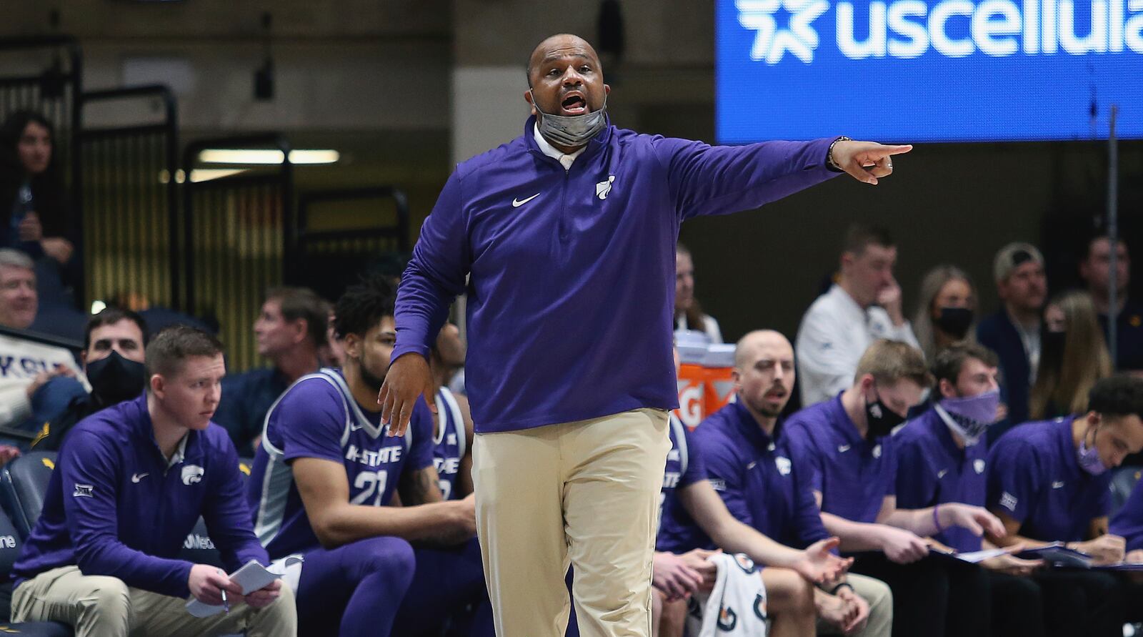 Kansas State assistant coach Jermaine Henderson reacts during the second half of an NCAA college basketball game against West Virginia in Morgantown, W.Va., Saturday, Jan. 8, 2022. (AP Photo/Kathleen Batten)