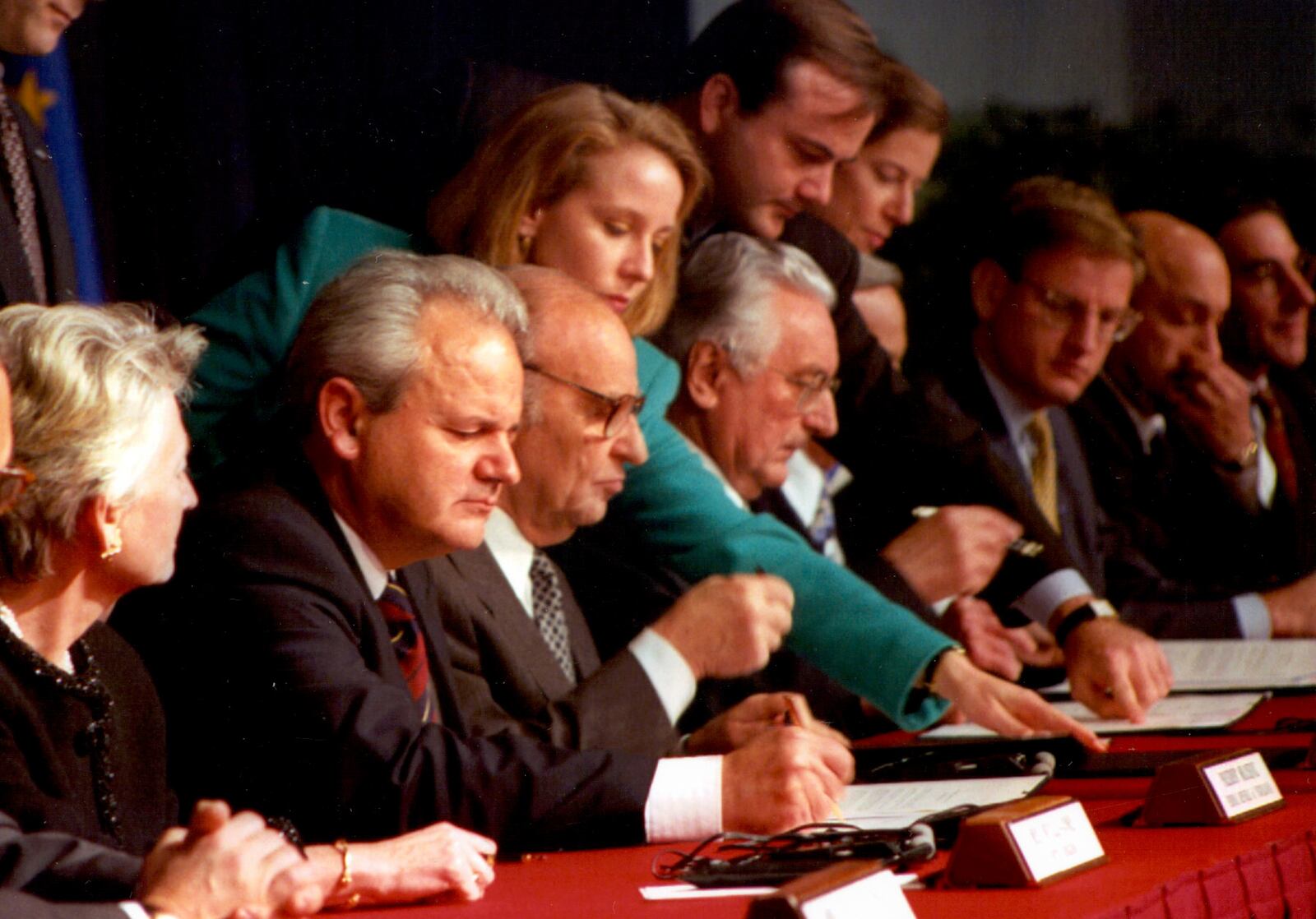 Serbian President Slobodan Milosevic, Bosnian president Alija Izetbegovic and Croatian President Franjo Tudjman initial a pact Nov. 21, 1995  after 21 days of peace talks at Wright-Patterson Air Force Base. PHOTO COURTESY OF THE UNITED STATES AIR FORCE�