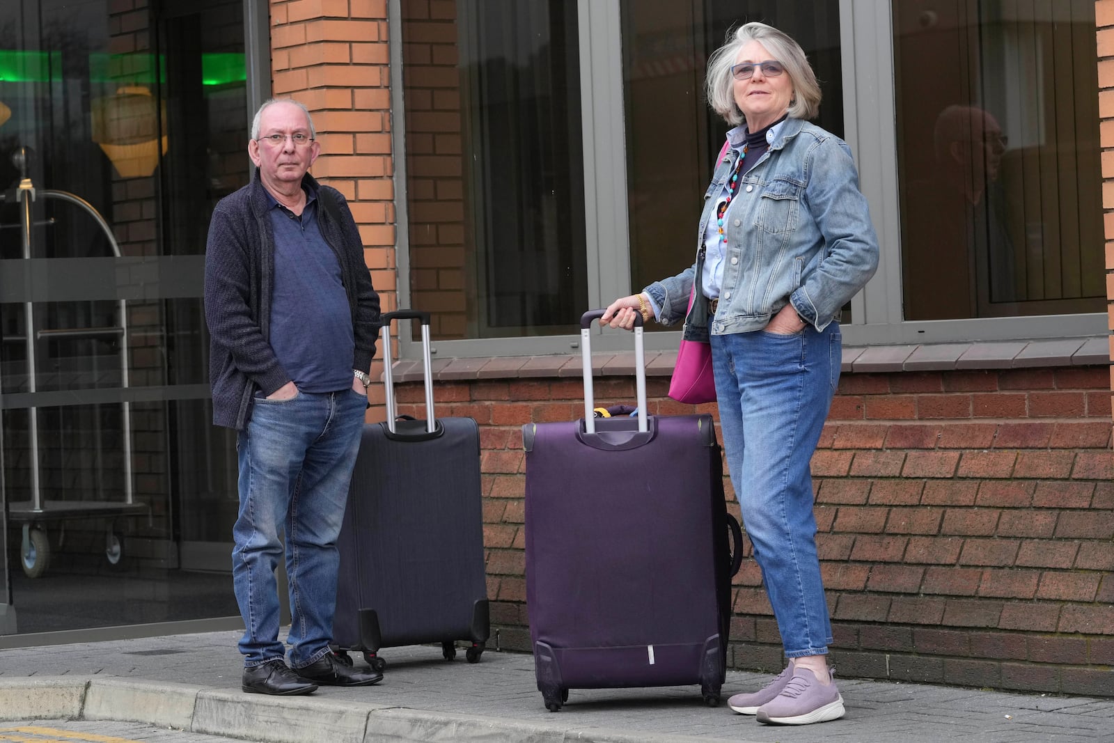 British travellers Rajih Alshibli and Michele planning to go to Bahrain to see their daughter are stranded after Britain's Heathrow Airport has closed for the full day Friday after an electrical substation fire knocked out its power, disrupting flights for hundreds of thousands of passengers at one of Europe's biggest travel hubs in London, Friday, March 21, 2025.(AP Photo/Kin Cheung)