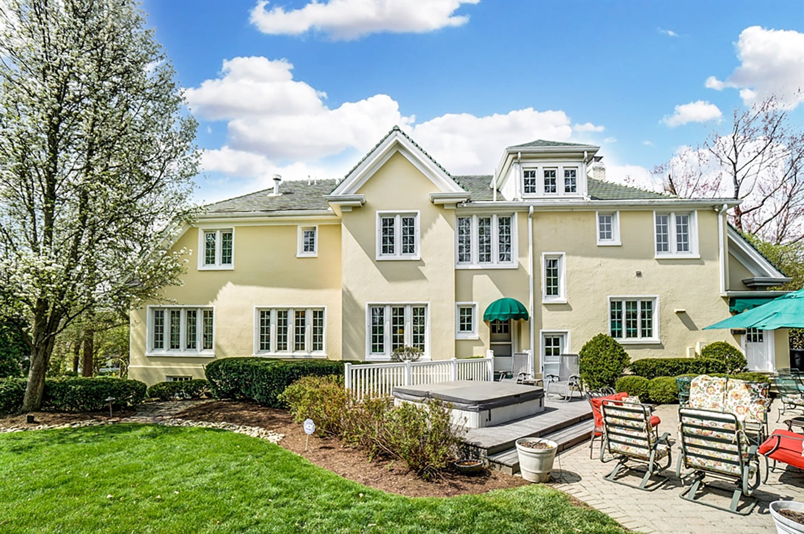 With Hanauer stone work in the front and back yards, along with Trex decking surrounding hot tub, the exterior has been updated. A stone patio with accent walls and elevated gardens looks out over the lawn. CONTRIBUTED PHOTO