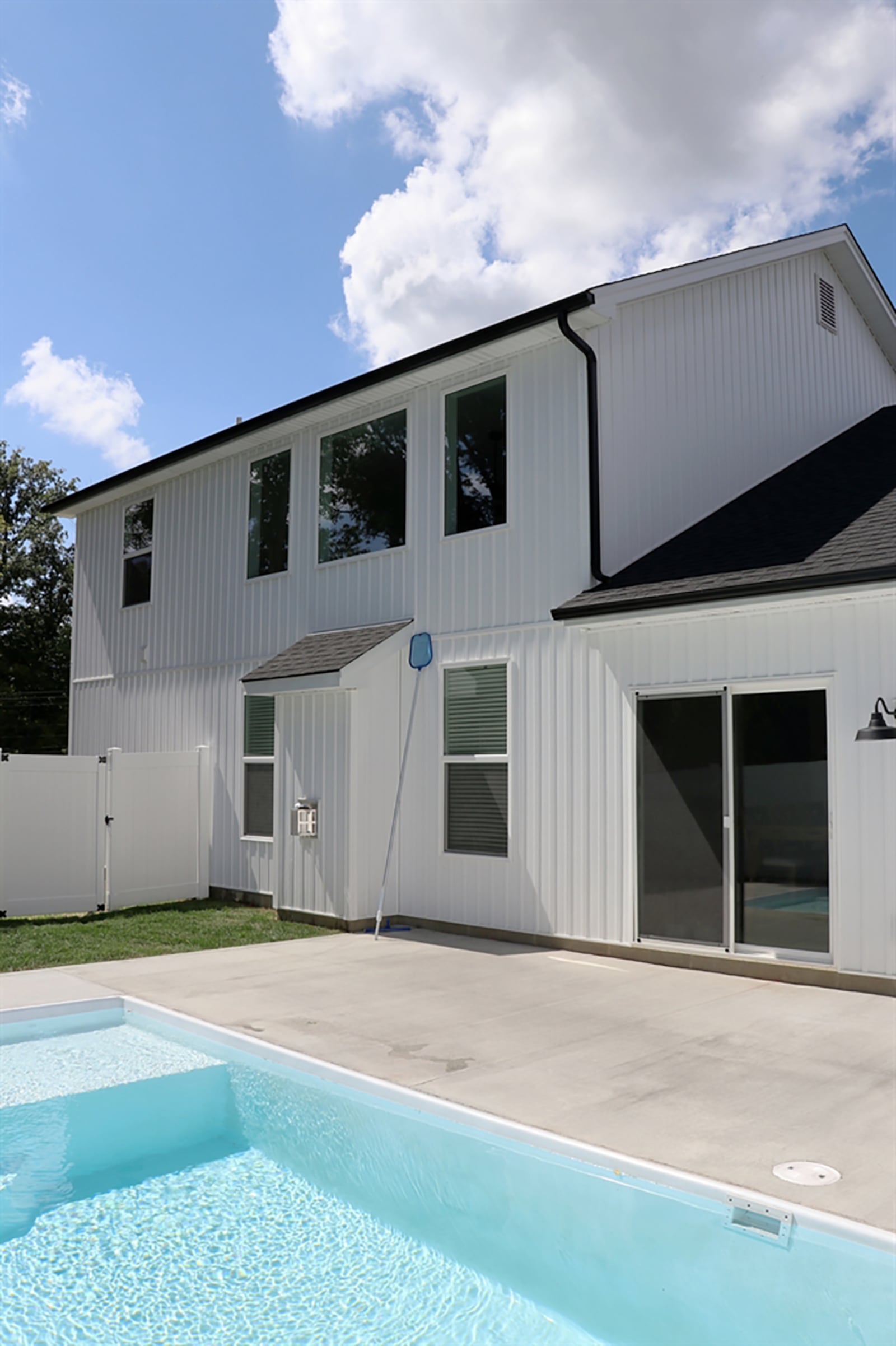 Sliding patio doors open off the dining area to the privacy backyard pool deck. The in-ground fiberglass swimming pool is surrounded by a concrete sun deck, and a white-vinyl privacy fence surrounds the pool area and a small grassy area. CONTRIBUTED PHOTO BY KATHY TYLER