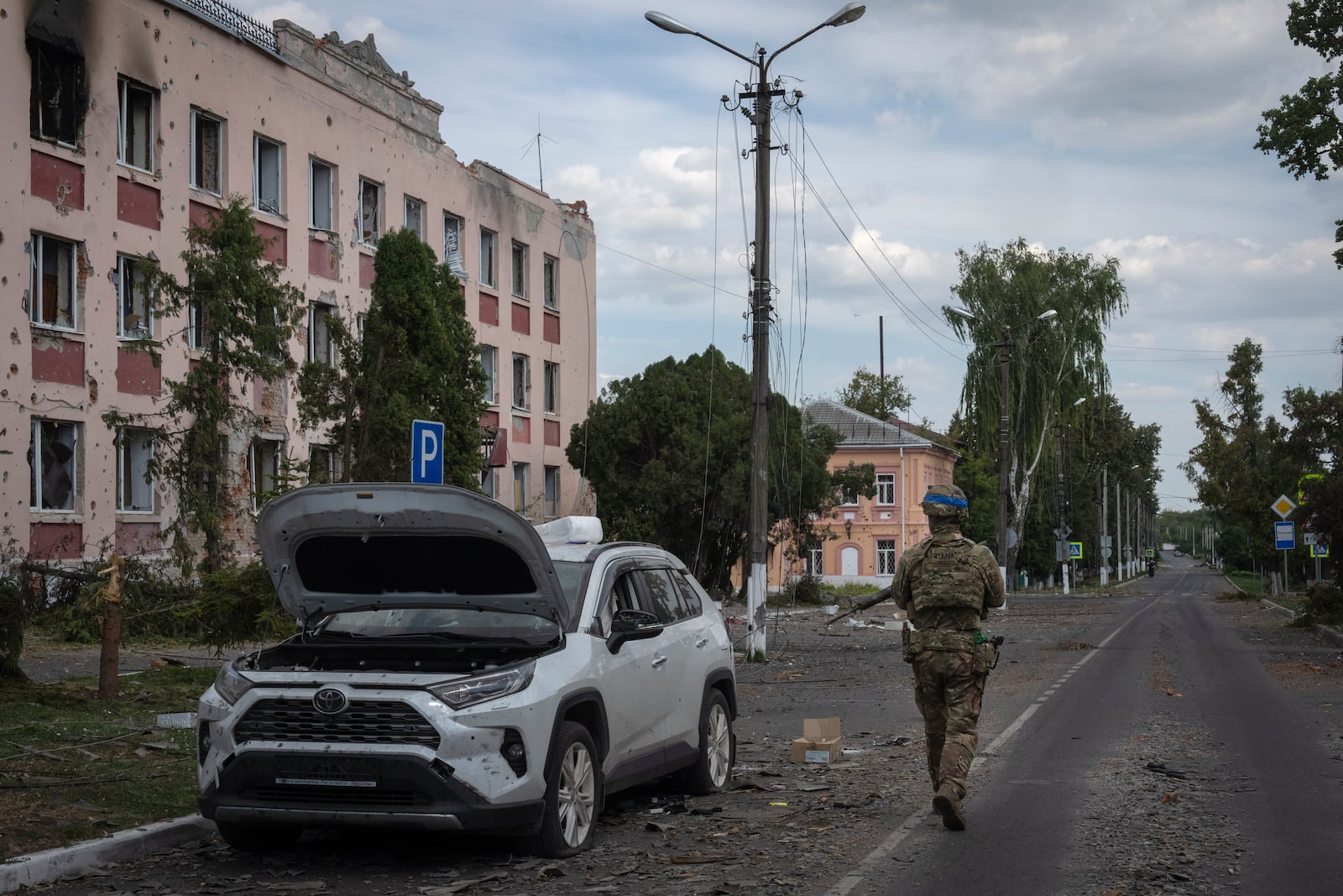 FILE - A Ukrainian soldier walks past at a city hall in Sudzha, Kursk region, Russia, Friday, Aug. 16, 2024. This image was approved by the Ukrainian Defense Ministry before publication. (AP Photo, File)