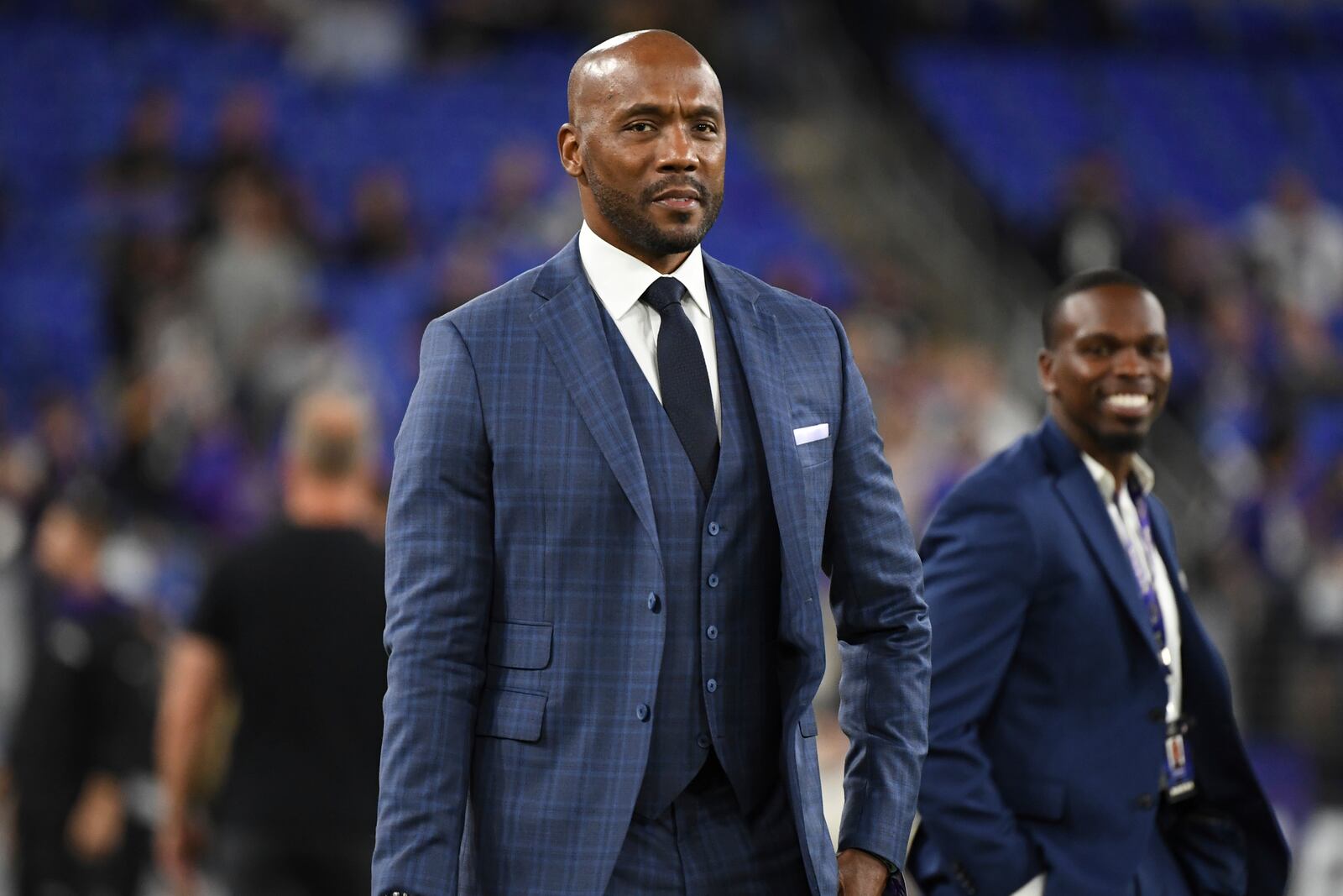 FILE - ESPN's Monday Night Football analyst Louis Riddick walks on the field during pre-game warm-ups before an NFL football game between the Baltimore Ravens and the Indianapolis Colts, on Oct. 11, 2021, in Baltimore, Md. (AP Photo/Terrance Williams, File)