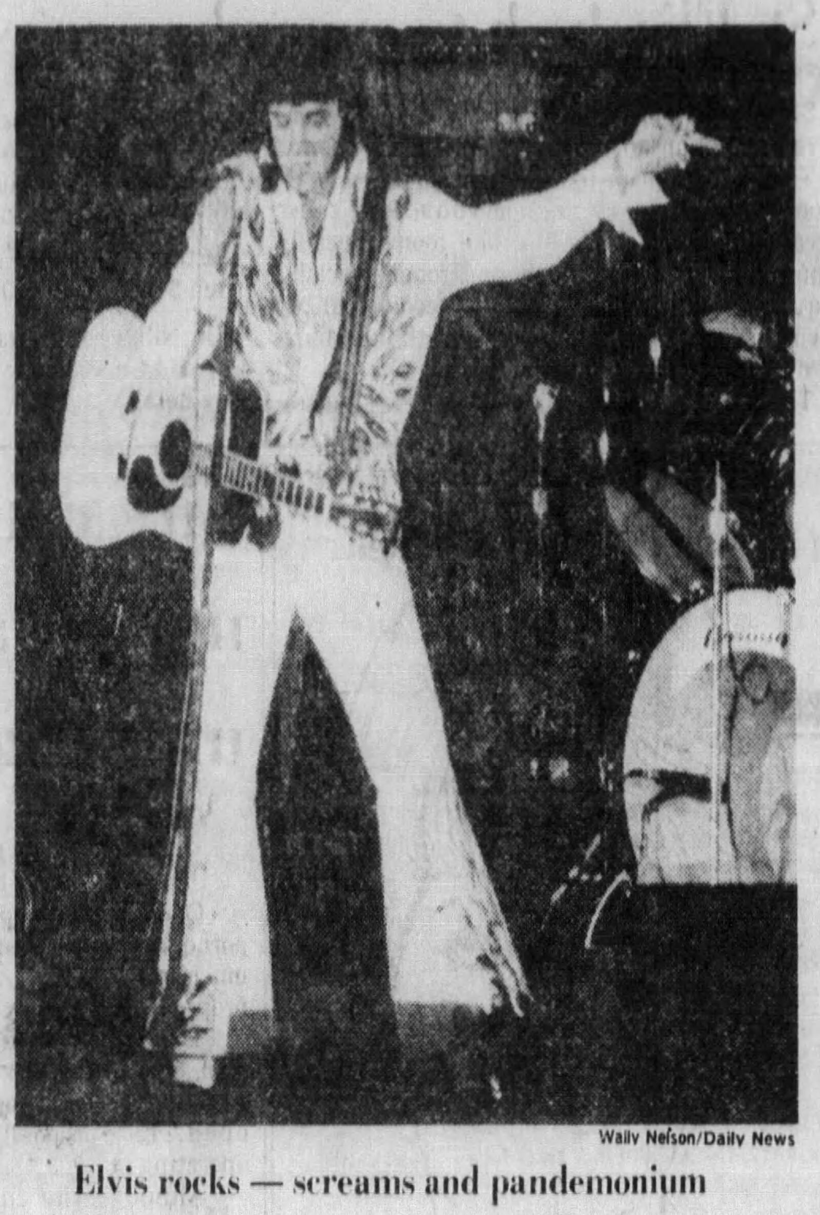 Oct. 27, 1976: Elvis Presley wiggles; crowd storms stage. DAYTON DAILY NEWS ARCHIVES