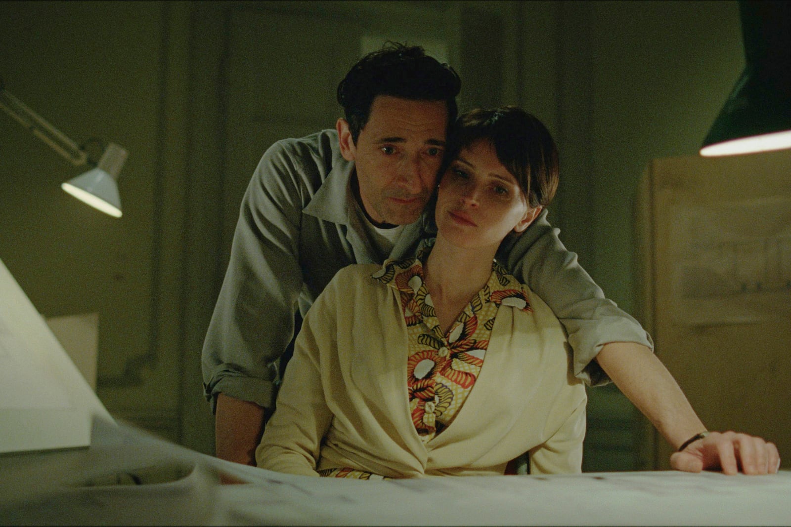 This image released by A24 shows Adrien Brody, left, and Felicity Jones in a scene from "The Brutalist." (A24 via AP)