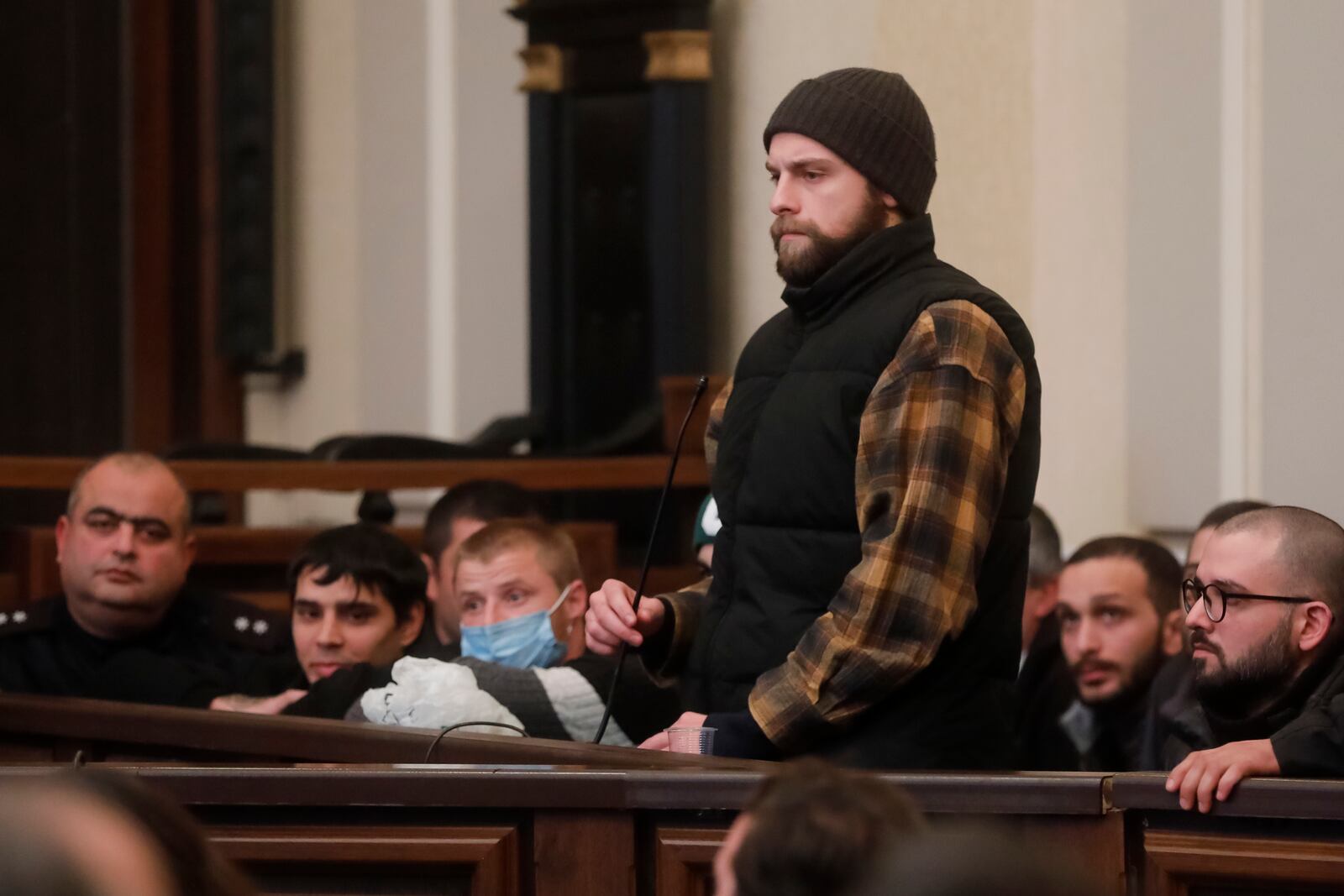 Andro Chichinadze, 28, a theater and film actor who was jailed for taking part in protests, attends a court session in Tbilisi, Georgia, Friday, Jan. 10, 2025. (AP Photo/Natia Leverashvili)