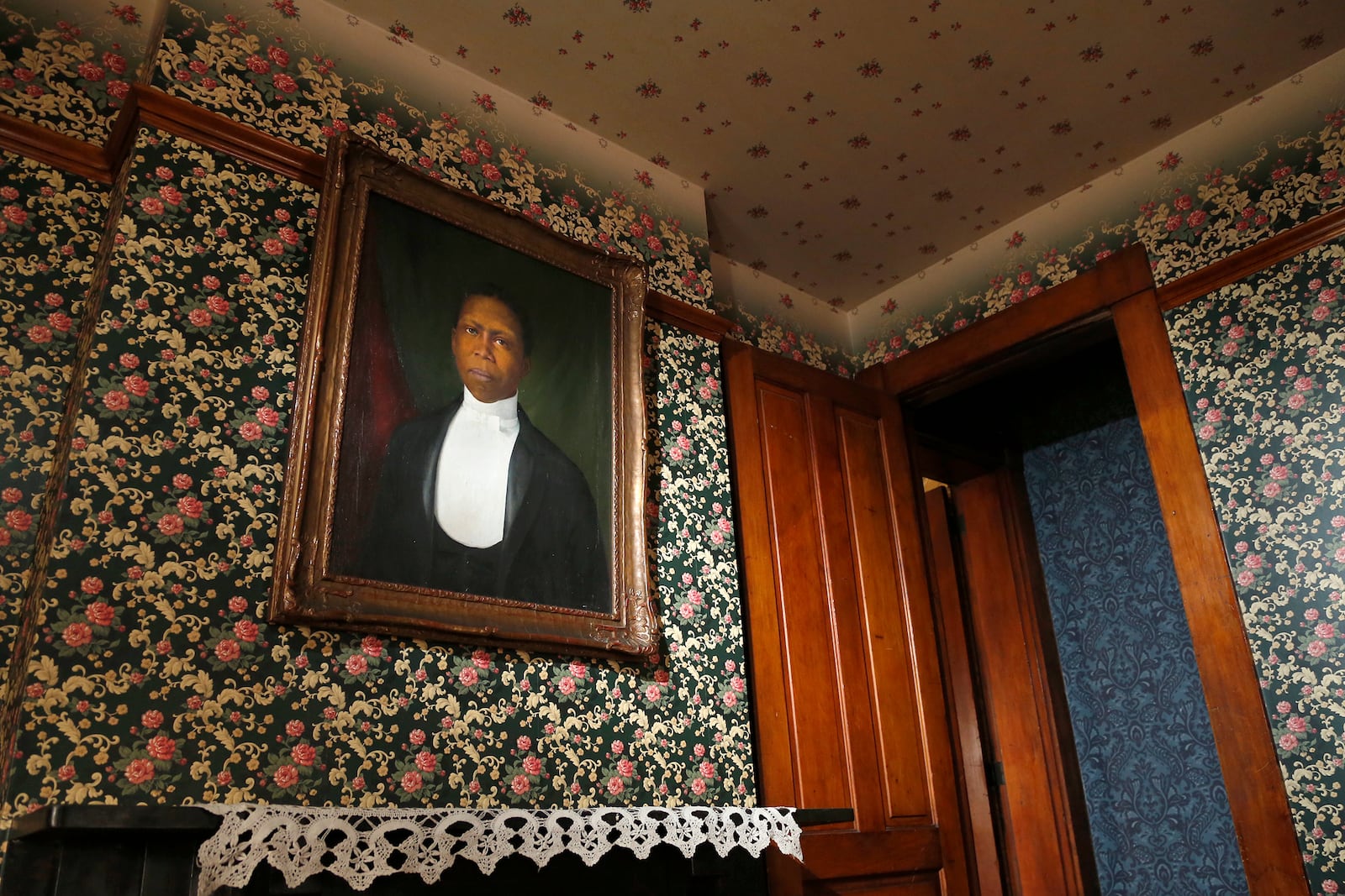 A portrait of Paul Laurence Dunbar painted in 1904 hangs over a mantle in the Paul Laurence Dunbar House in Dayton.