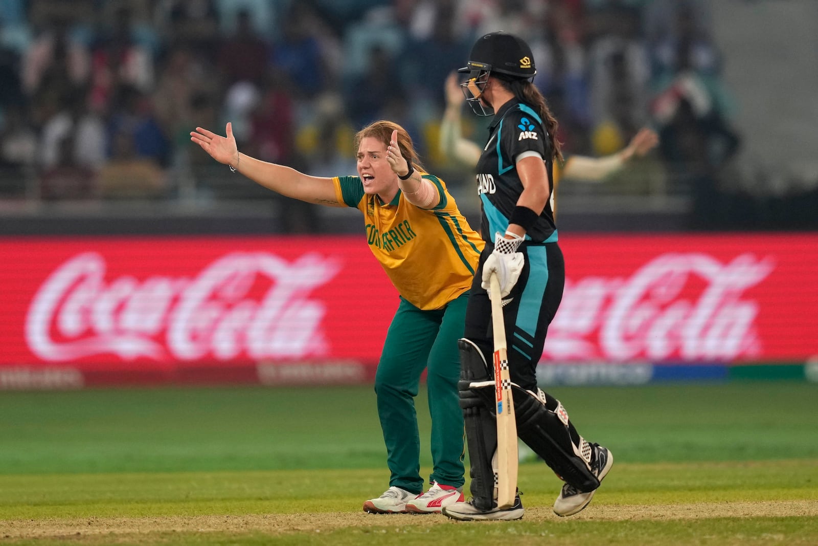 South Africa's Nadine de Klerk, left, appeals successfully for the wicket of New Zealand's captain Sophie Devine during the ICC Women's T20 World Cup 2024 final match between New Zealand and South Africa at Dubai, United Arab Emirates, Sunday, Oct. 20, 2024. (AP Photo/Altaf Qadri)